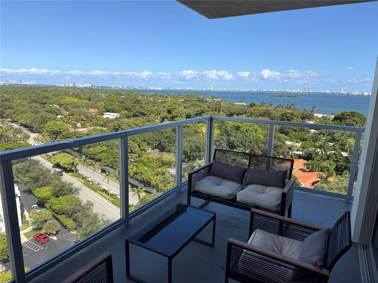 3900 Biscayne Boulevard, #N-1113, Miami, FL 33137 Private balcony featuring glass panel railings and expansive overhead coverage