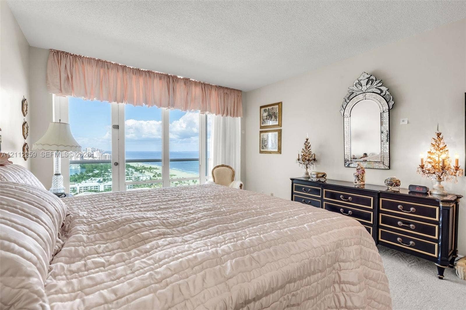 Floor-to-ceiling windows with expansive water and coastline scenery