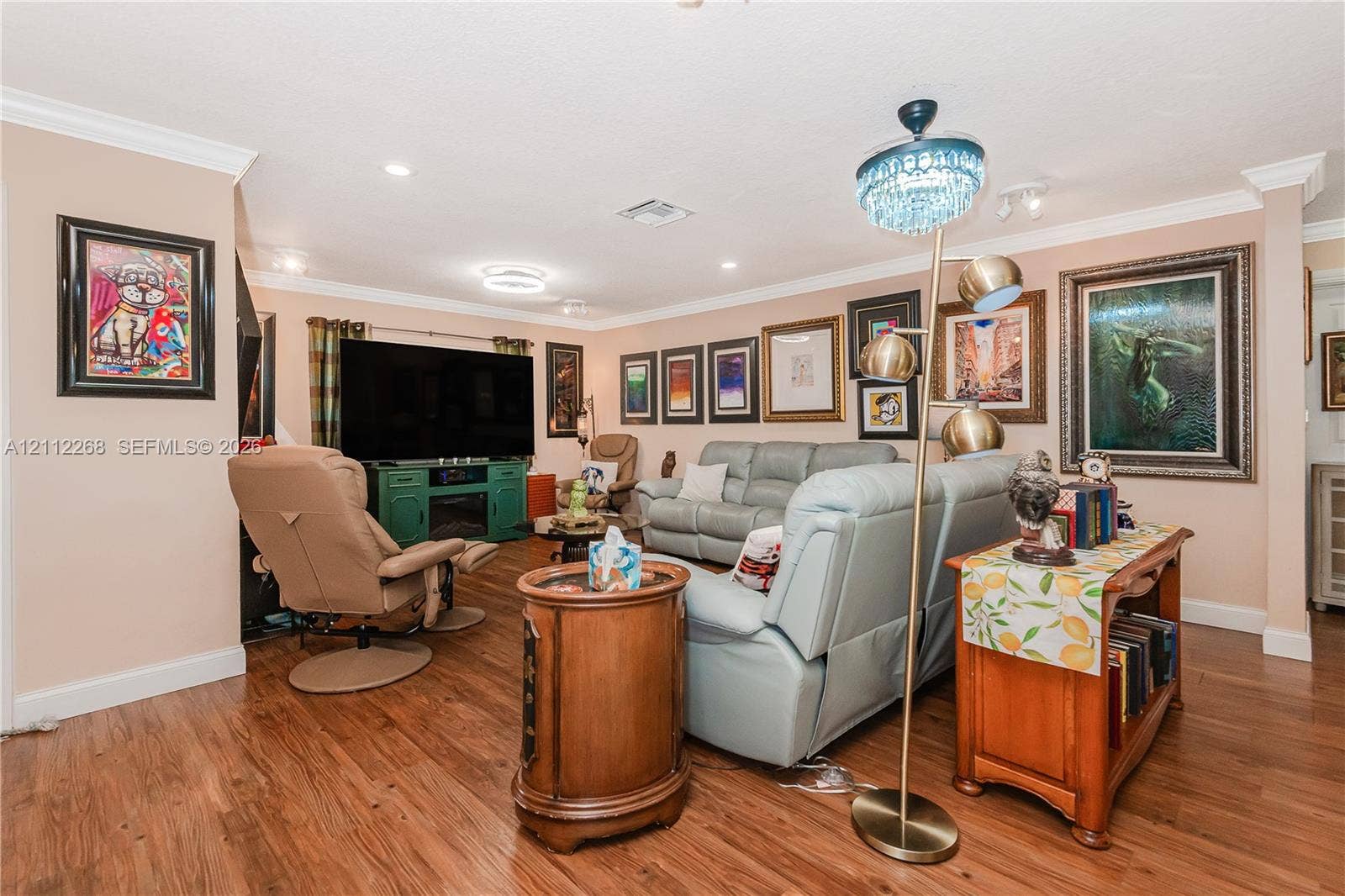 5941 SW 16th Court, Plantation, FL 33317 Living area featuring wood-finish flooring, crown molding, and recessed lighting