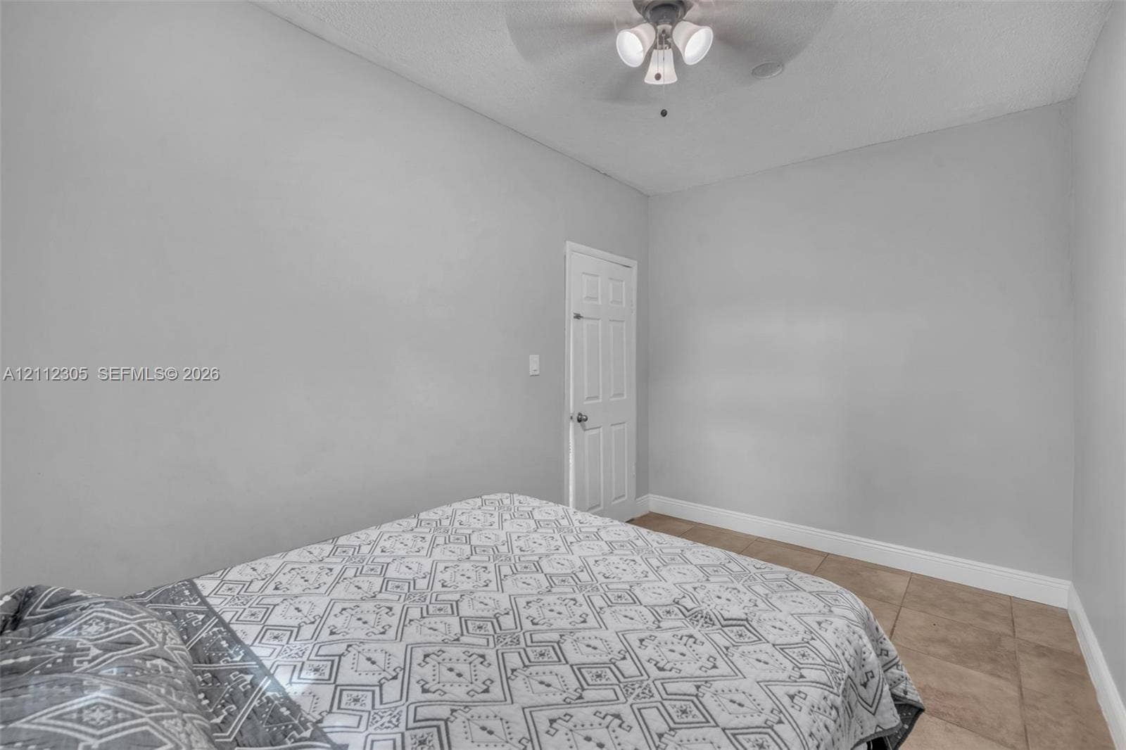 1008 N 18th Court, Hollywood, FL 33020 Interior space featuring neutral-toned wall paint, tile flooring, and a multi-light ceiling fan
