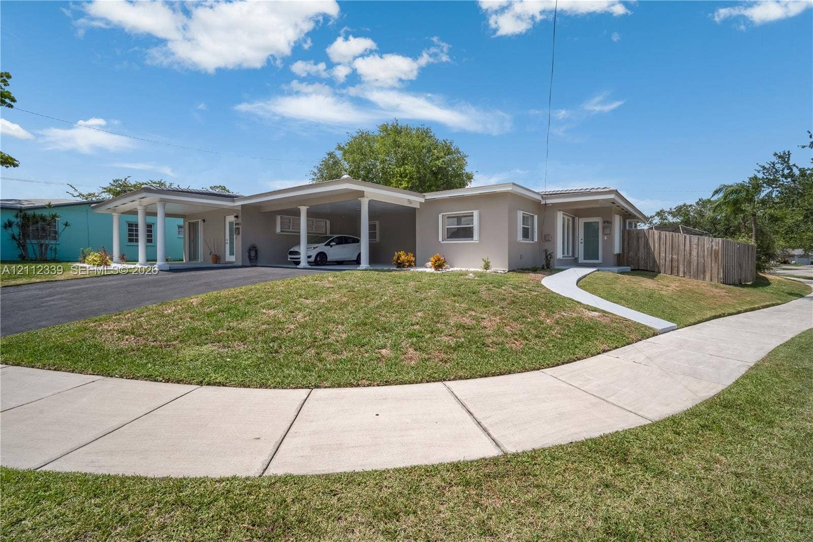 8901 SW 149th Terrace, #n/a, Palmetto Bay, Palmetto Bay, FL 33176 Fully renovated single-story duplex in light-toned exterior finish, and fenced yard area