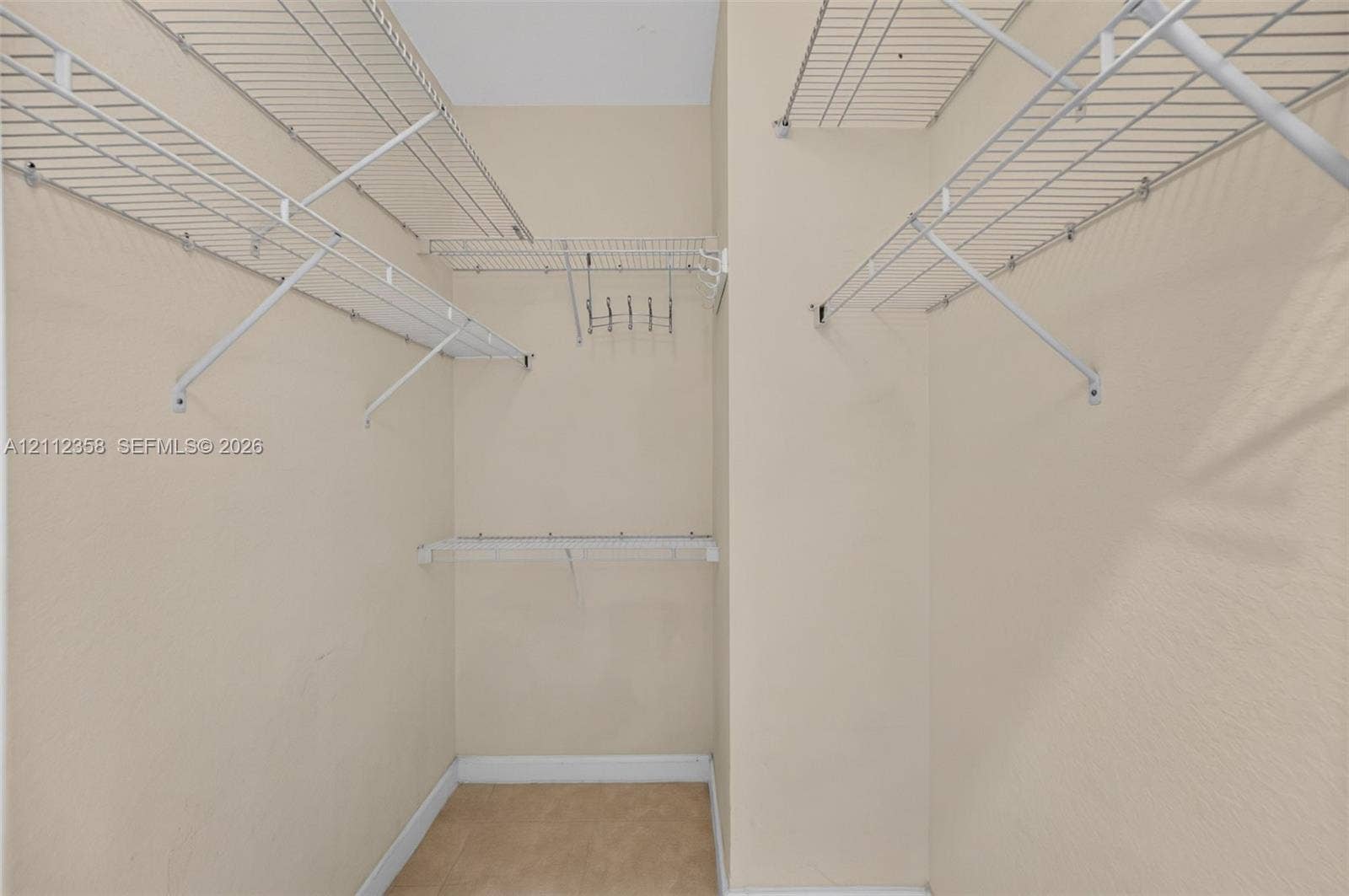1611 SE 16th Street, Homestead, FL 33035 Walk-in storage space featuring multi-level white wire shelving and a mounted hook rack
