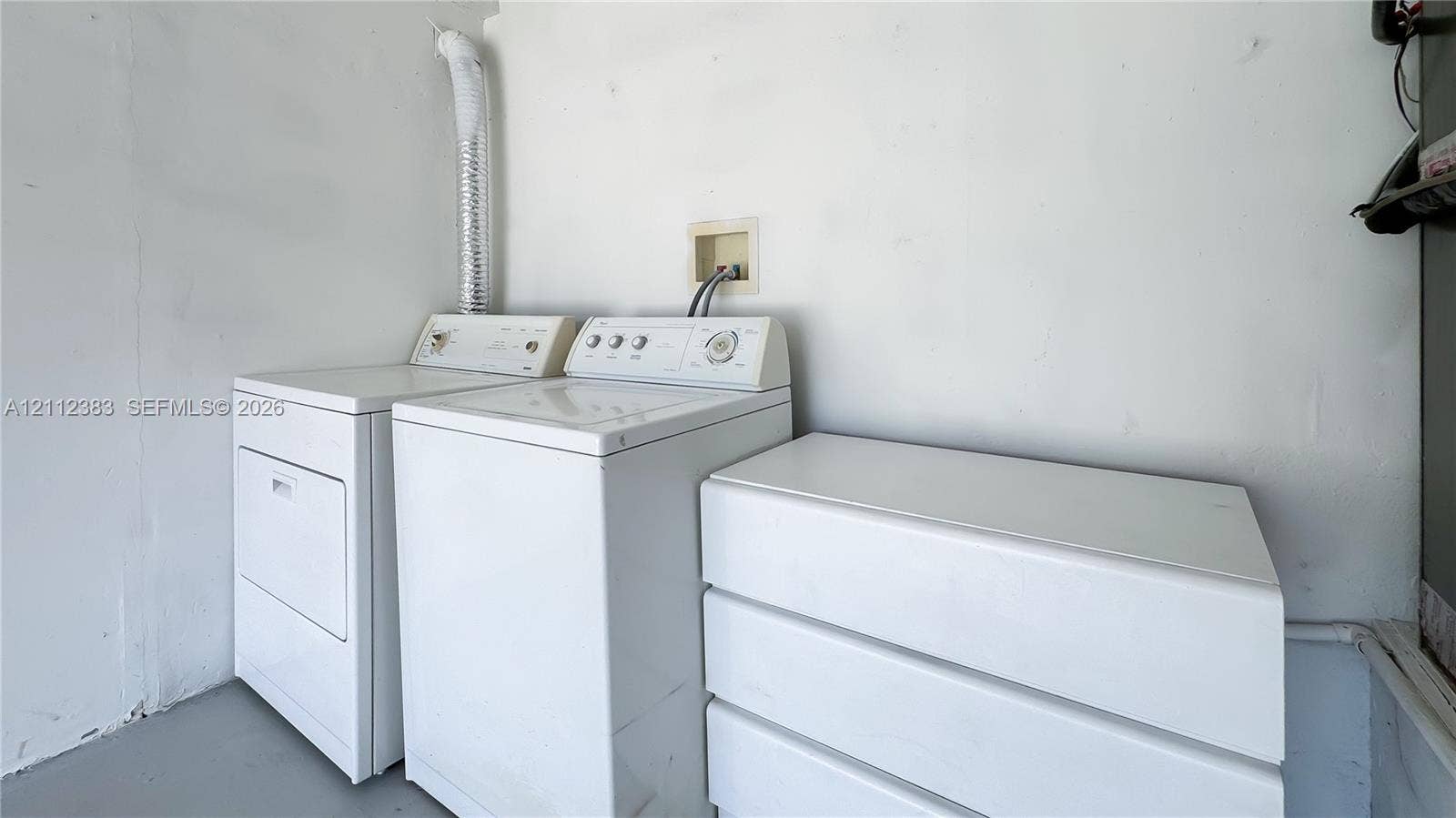 5319 Lake Boulevard, Delray Beach, Delray Beach, FL 33484 Utility space featuring white laundry appliances and a built-in white storage unit