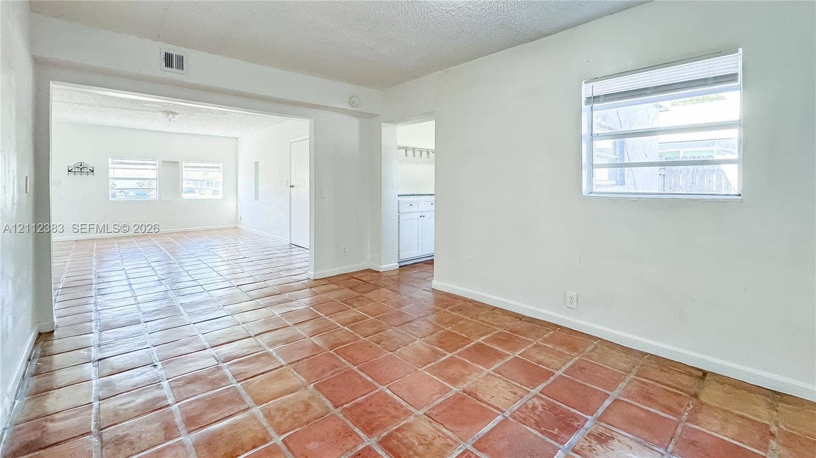 5319 Lake Boulevard, Delray Beach, Delray Beach, FL 33484 Ceramic tile flooring, horizontal slat windows, and painted walls