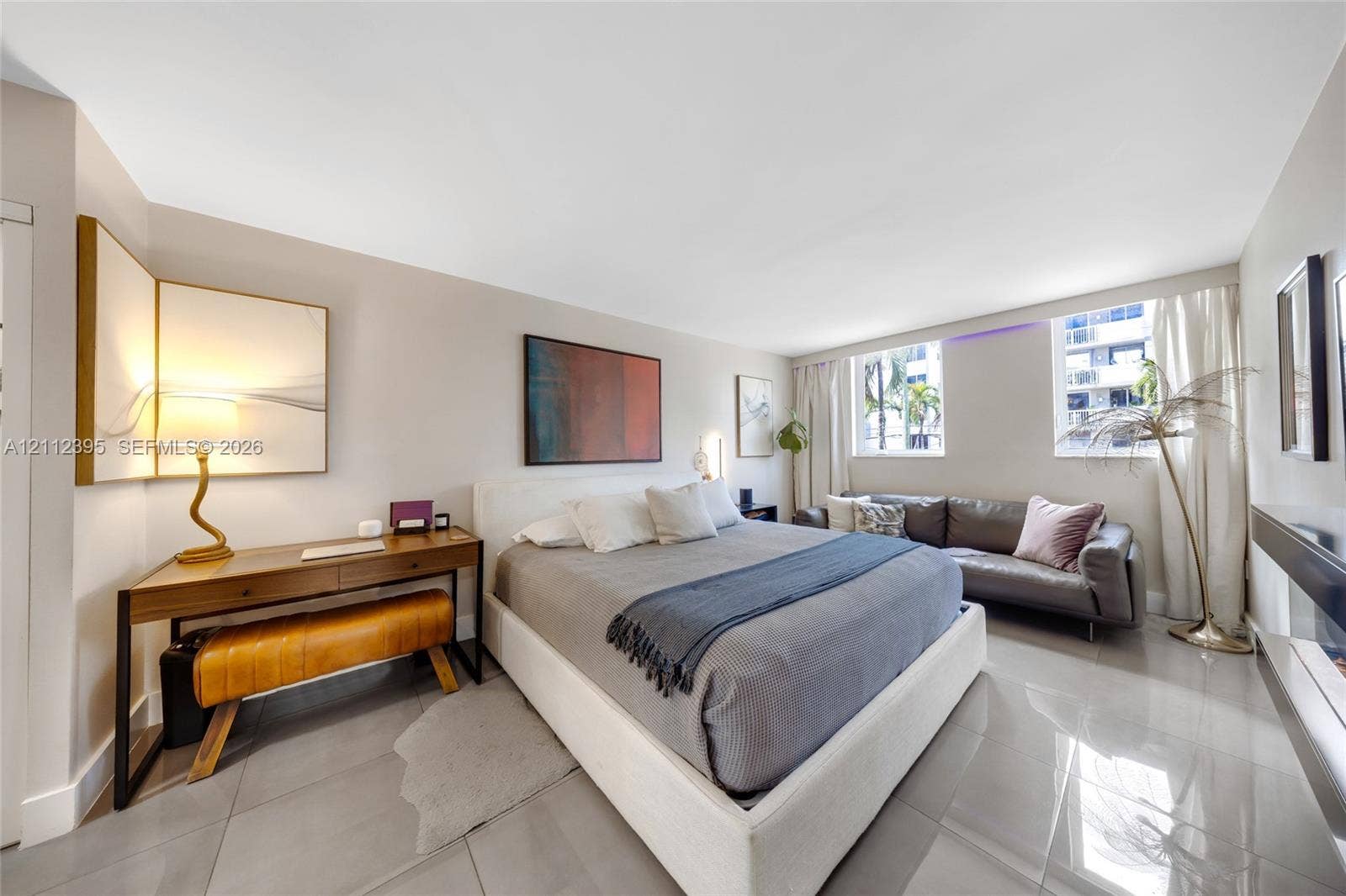 Large format tile flooring, neutral wall tones, and horizontal windows