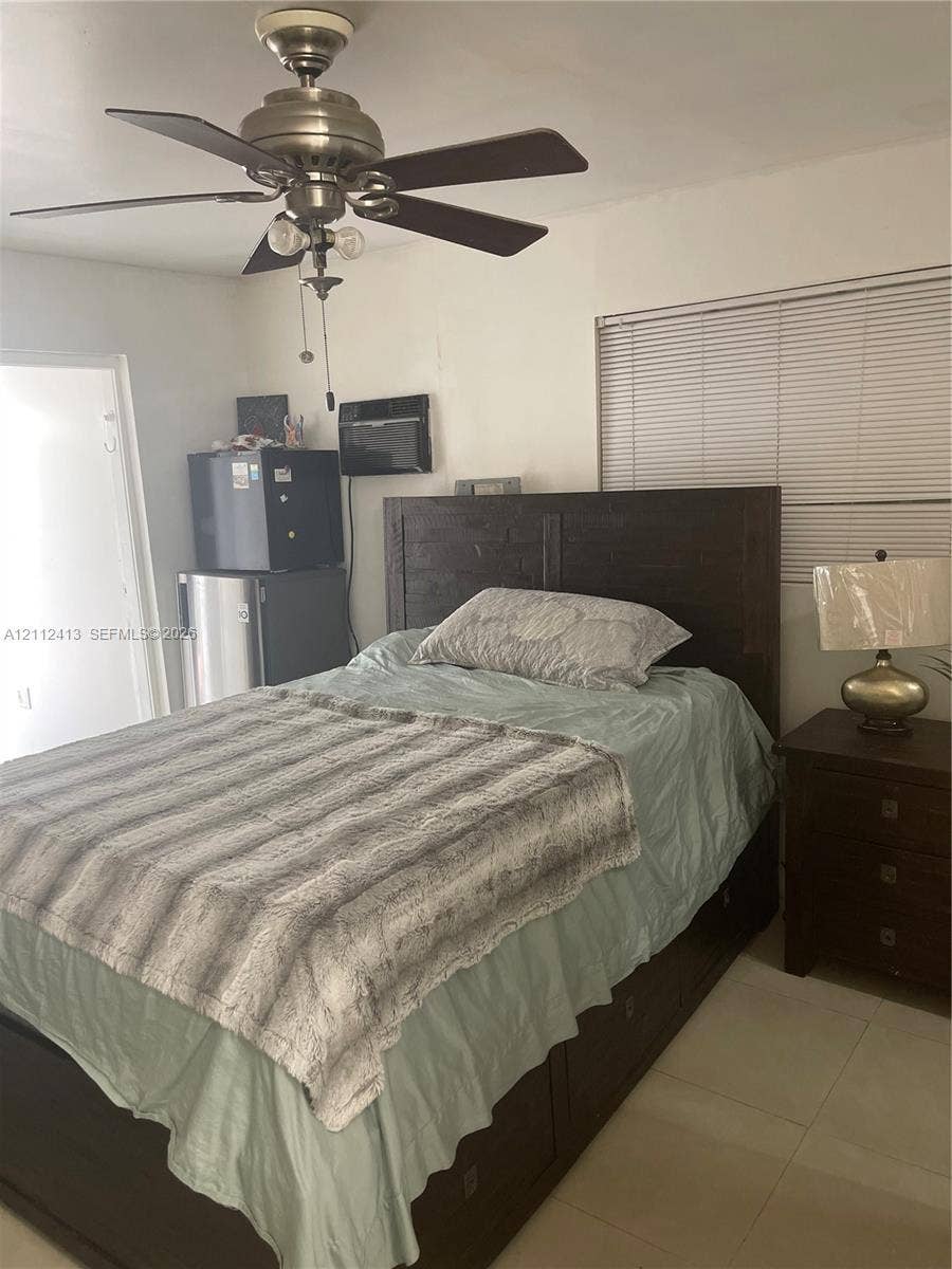 10830 Westwood Lake Drive, #0, Miami, Miami, FL 33165 Ceiling fan with integrated lighting, horizontal window blinds, and tile flooring