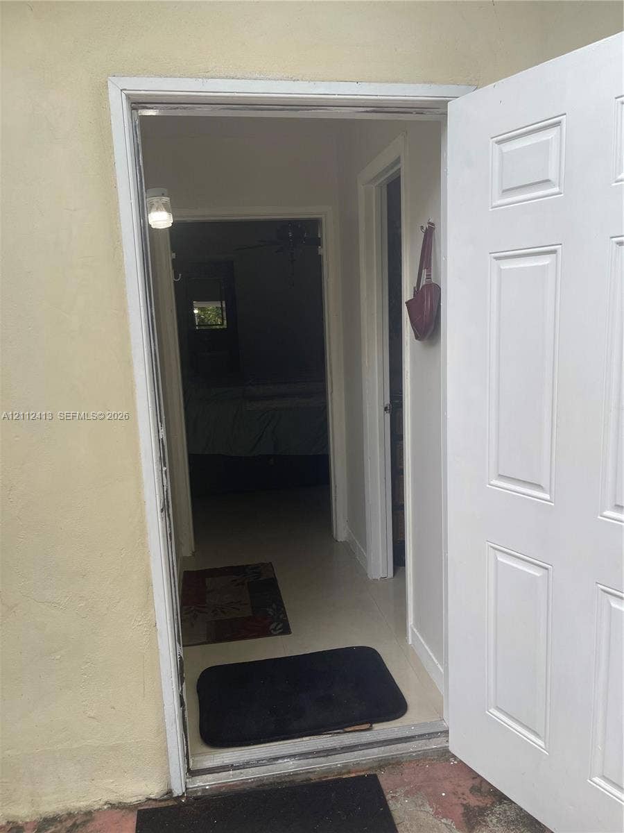 10830 Westwood Lake Drive, #0, Miami, Miami, FL 33165 Six-panel white entry door with light-colored interior walls and neutral-tone flooring