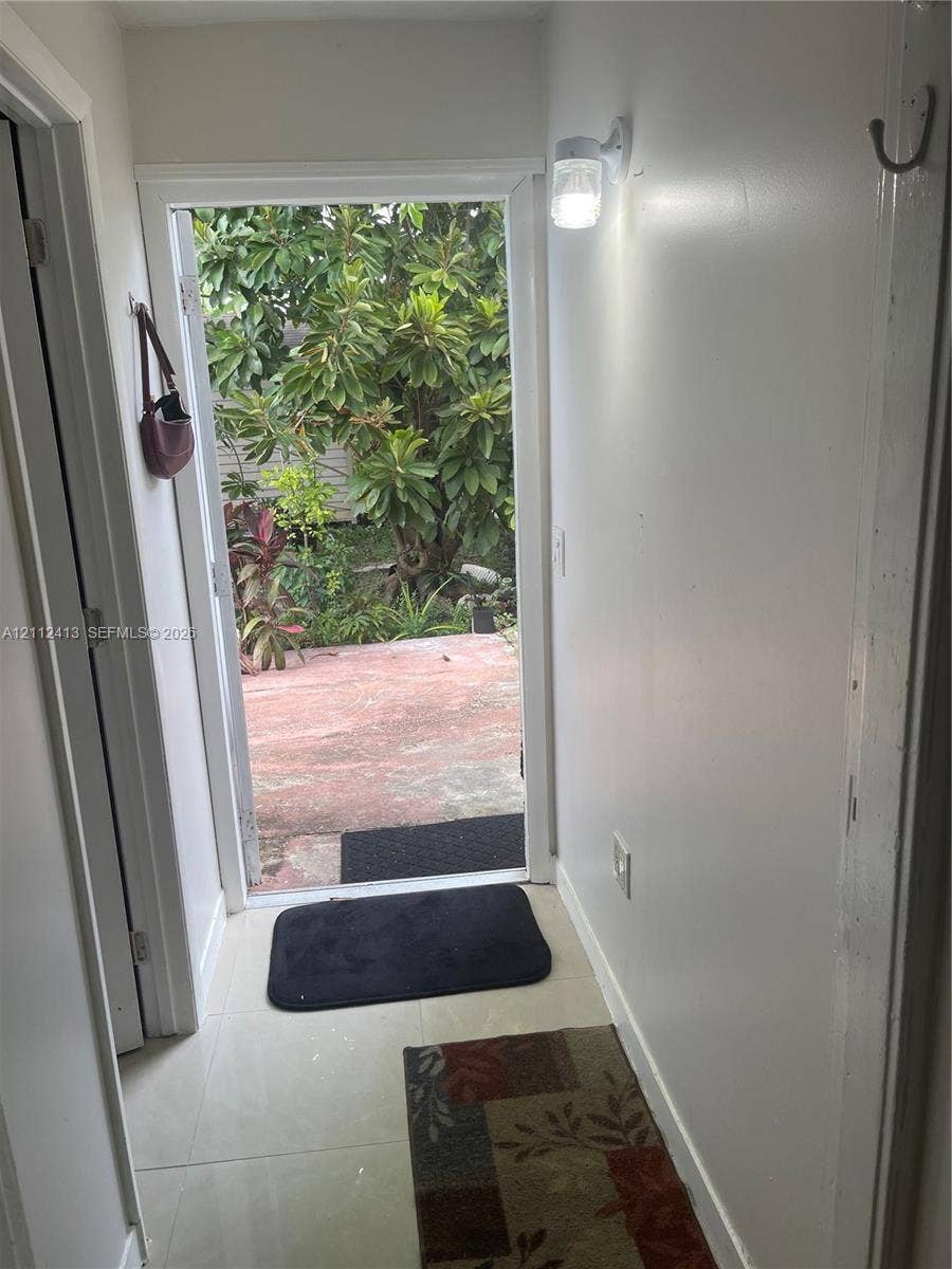 10830 Westwood Lake Drive, #0, Miami, Miami, FL 33165 Entrance featuring light-toned tile flooring and a wall-mounted fixture