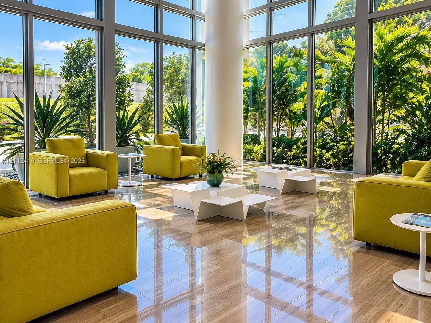 Floor-to-ceiling windows, polished stone flooring, and structural column