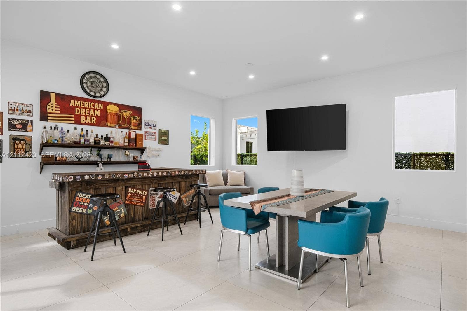 10054 NW 76th Terrace, Doral, FL 33178 Recessed lighting, large-format tile flooring, and custom wood-finished wet bar with open shelving
