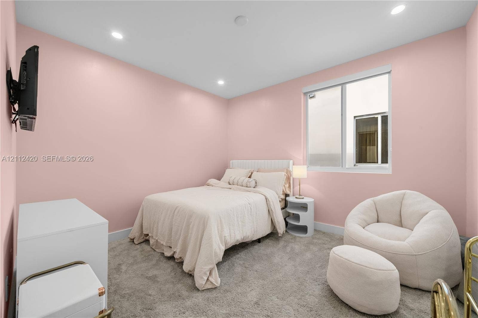 10054 NW 76th Terrace, Doral, FL 33178 Neutral-toned carpeting, recessed ceiling lighting, and a single-pane window