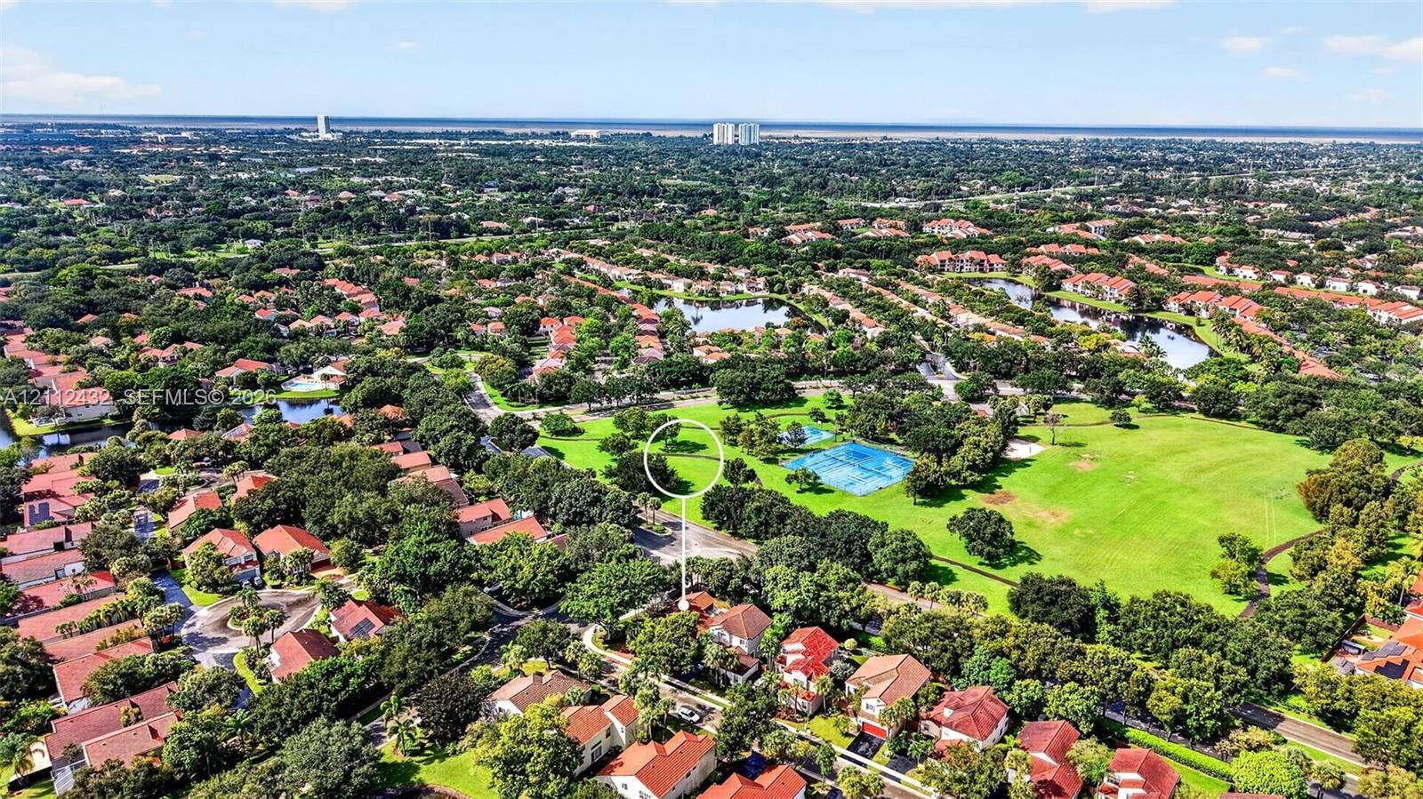 10545 NW 11th Court, Plantation, FL 33322 Aerial perspective featuring mature trees, expansive green space, and proximity to water elements