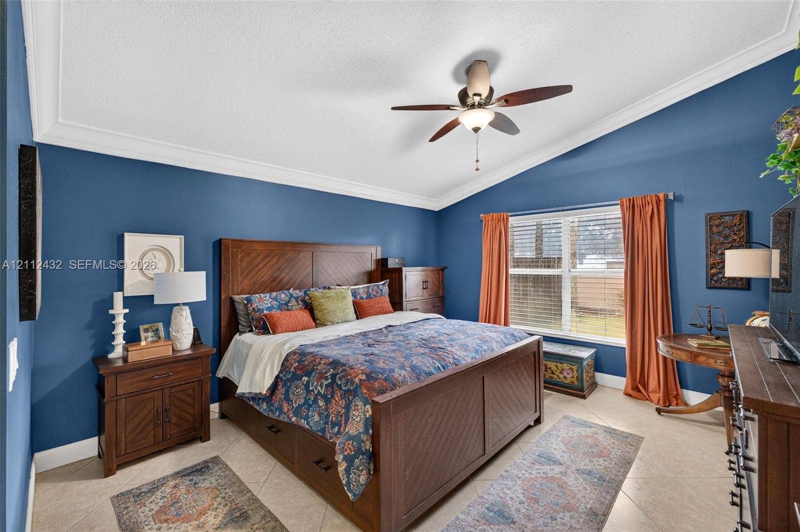 10545 NW 11th Court, Plantation, FL 33322 Vaulted ceilings, crown molding, ceramic tile flooring, and a central ceiling fan