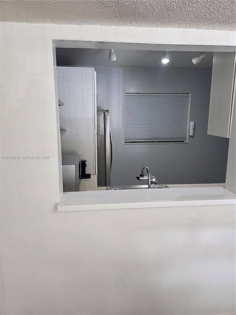 LARGER PASS THRU WINDOW TO DINING AREA