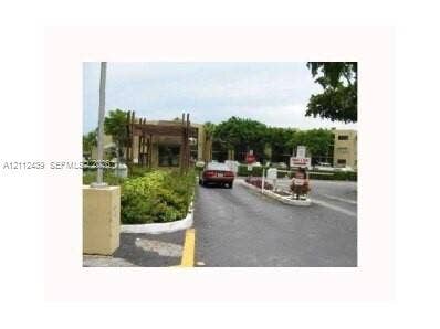 ENTRANCE TO COMPLEX 24 HR GUARD AT GATE