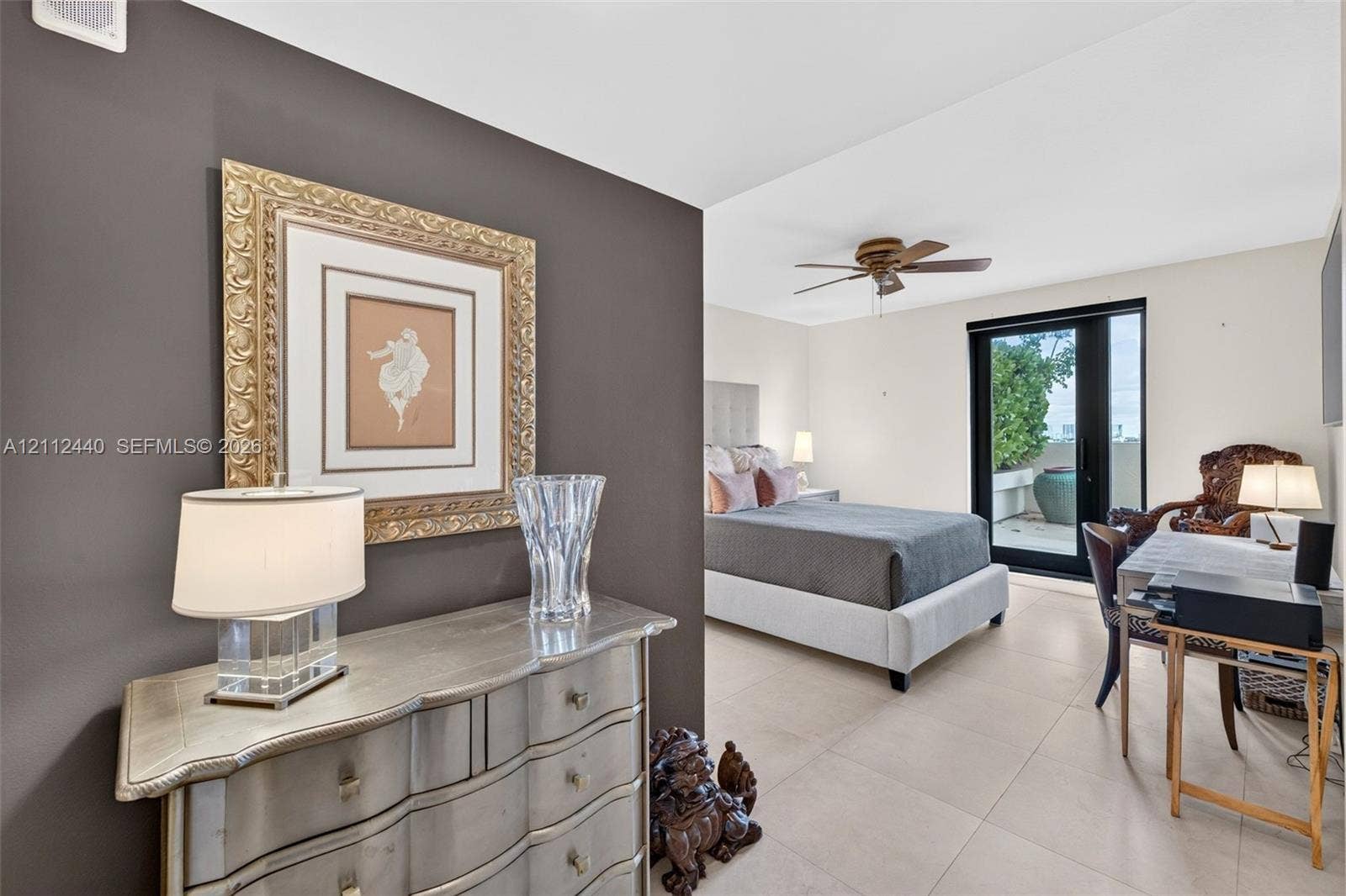 110 N Federal Highway, #914, Fort Lauderdale, FL 33301 Large-format porcelain flooring, ceiling fan with integrated lighting, and glass-paned exterior door with access to private balcony
