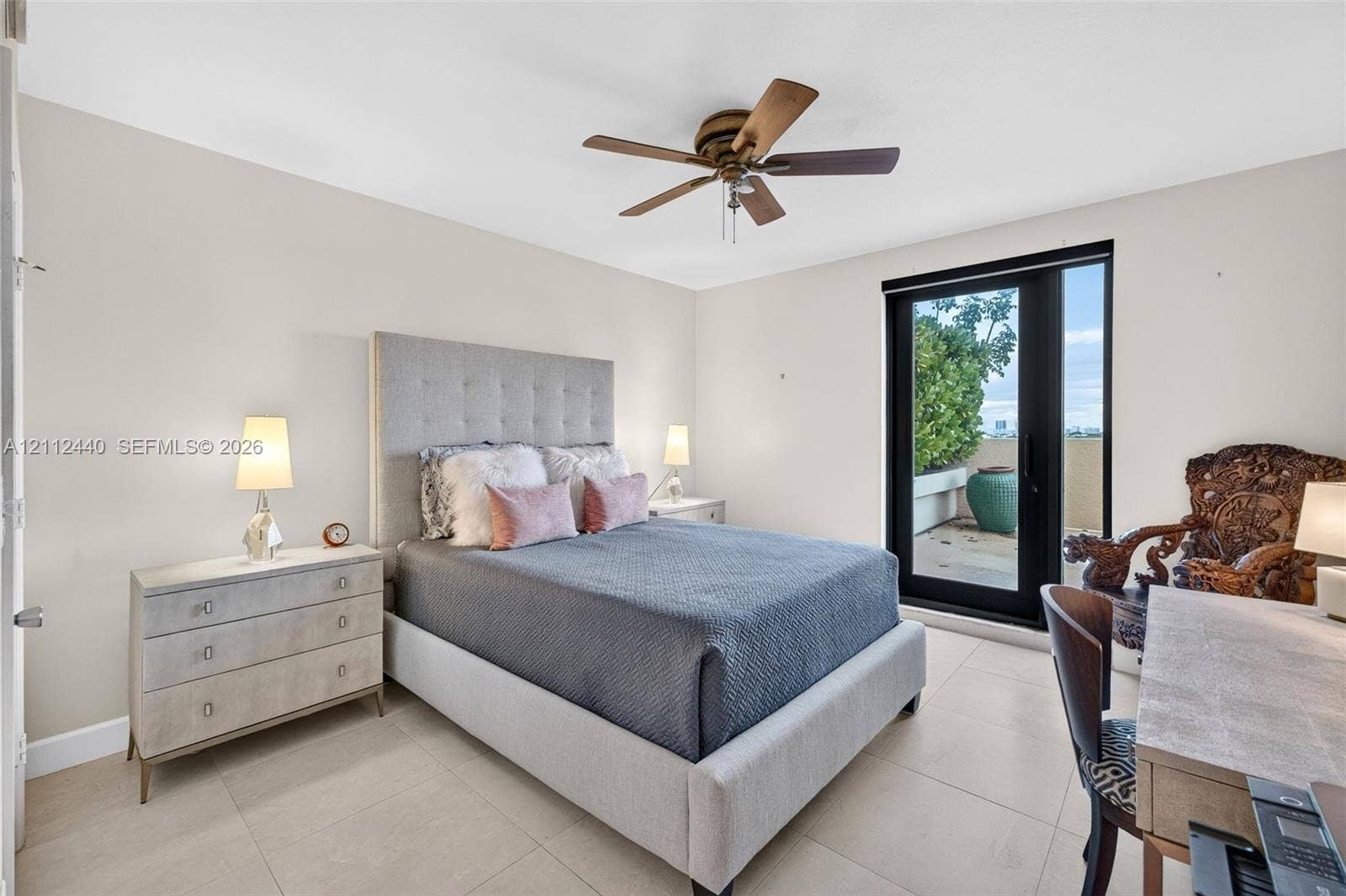 110 N Federal Highway, #914, Fort Lauderdale, FL 33301 Neutral-toned interior featuring large-format porcelain flooring, a ceiling fan with integrated lighting, and full-height glass door providing exterior access to another oversized private terrace