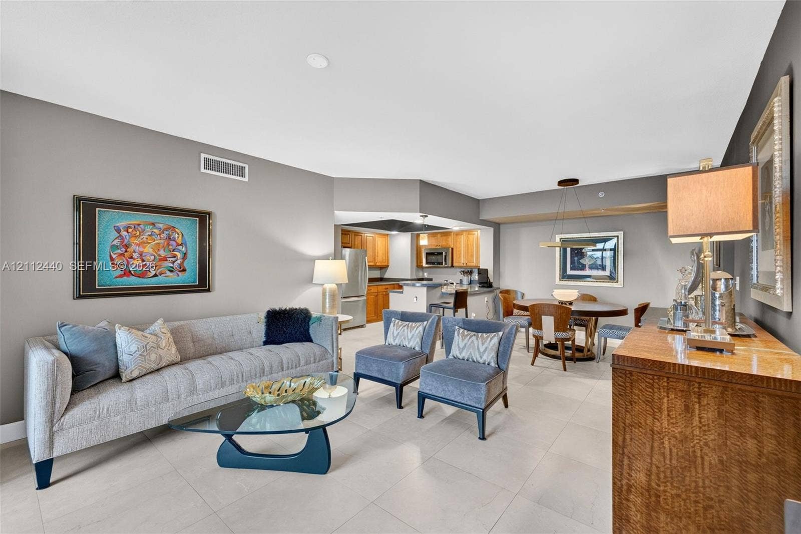 110 N Federal Highway, #914, Fort Lauderdale, FL 33301 Open-concept interior featuring large-format porcelain flooring, and a kitchen equipped with upgraded wood cabinetry