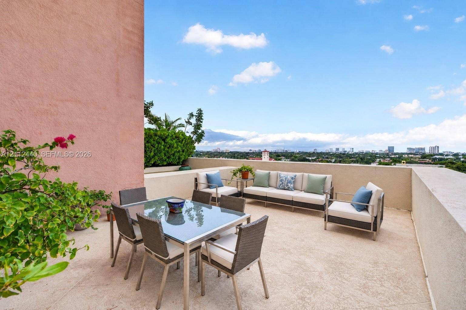 110 N Federal Highway, #914, Fort Lauderdale, FL 33301 Open-air terrace featuring a textured concrete floor, solid masonry perimeter walls, and built-in landscape planters