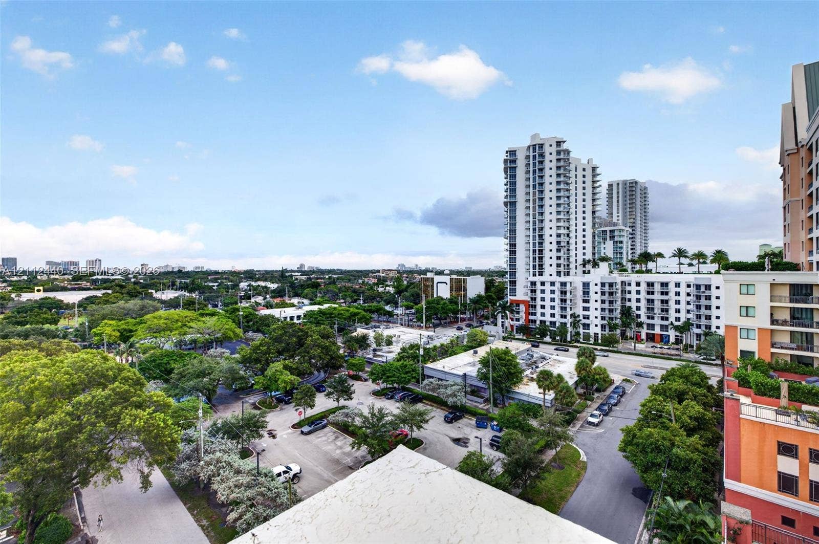 110 N Federal Highway, #914, Fort Lauderdale, FL 33301 Elevated panoramic perspective featuring urban architecture, multi-story high-rise buildings, and mature canopy trees