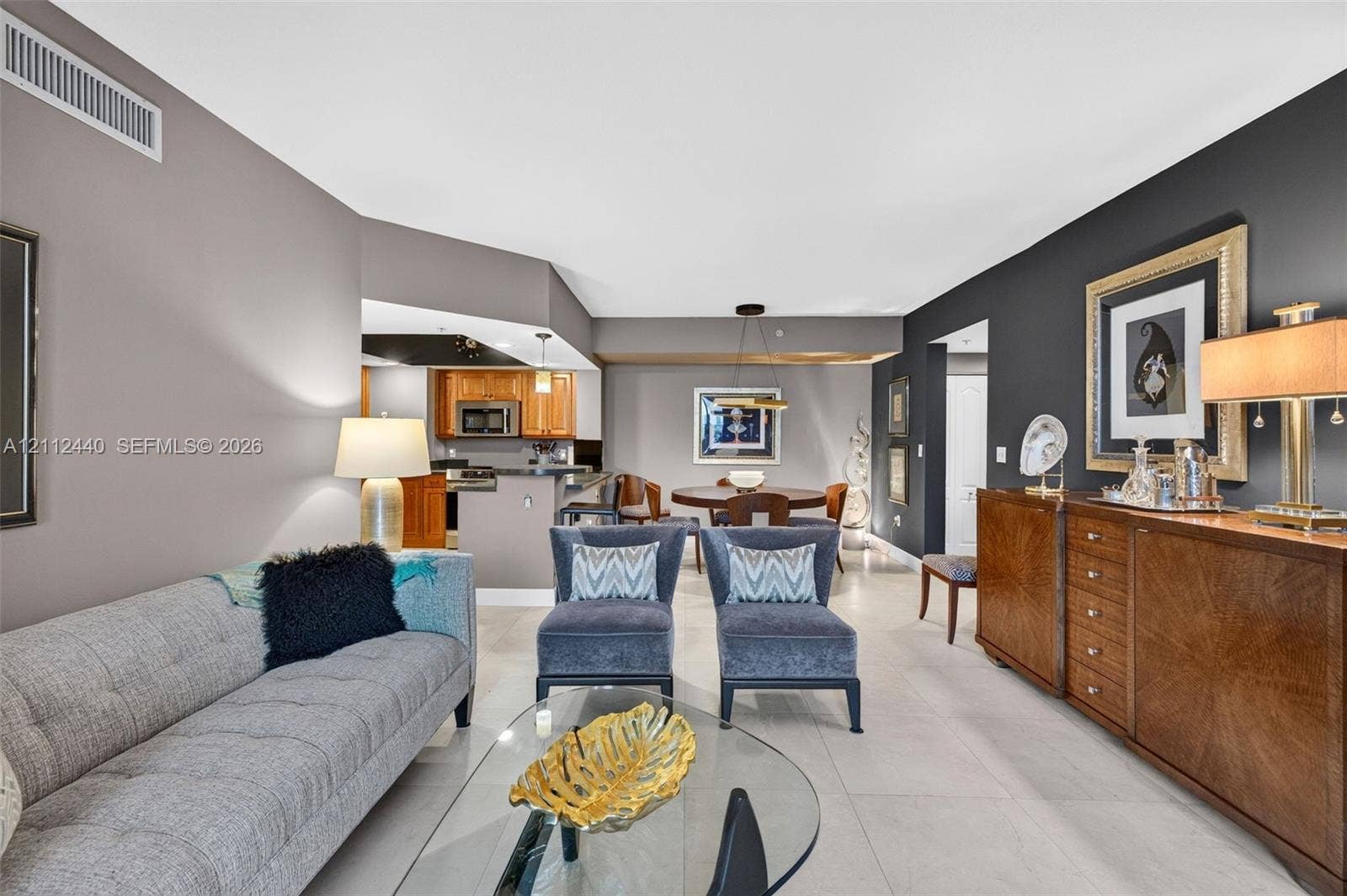 110 N Federal Highway, #914, Fort Lauderdale, FL 33301 Living area featuring neutral porcelain flooring and a dark accent wall