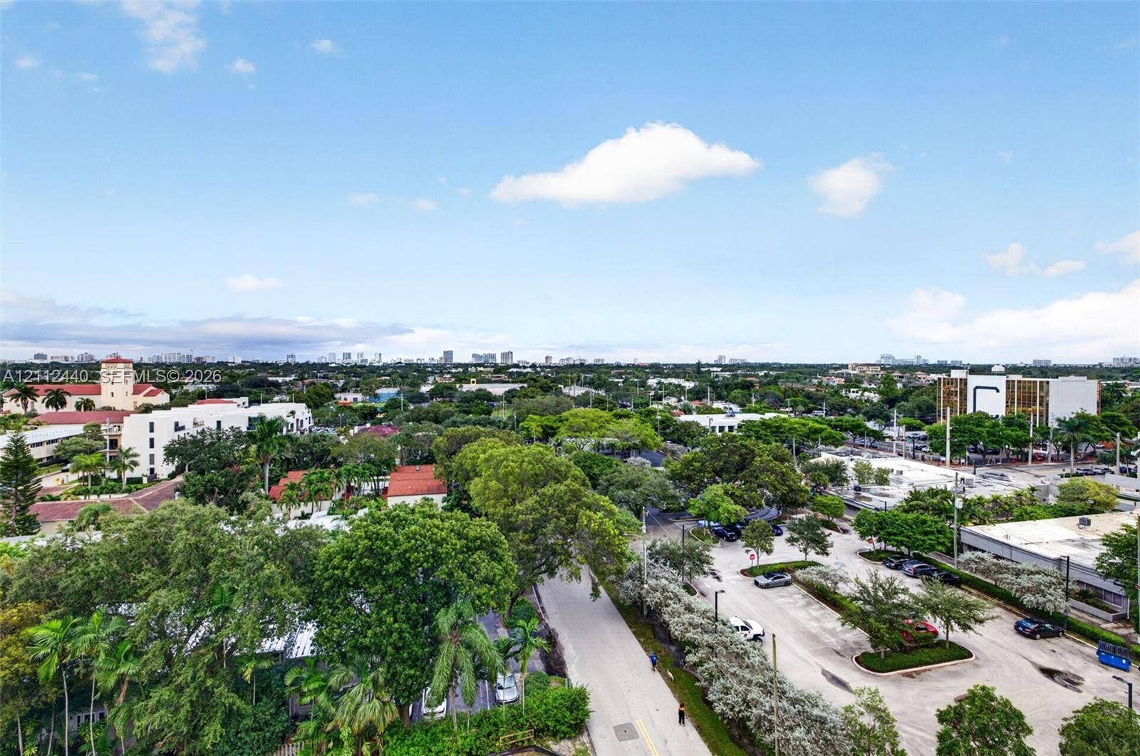 110 N Federal Highway, #914, Fort Lauderdale, FL 33301 Elevated aerial perspective featuring a wide-reaching skyline, expansive tree canopy, and established surface parking