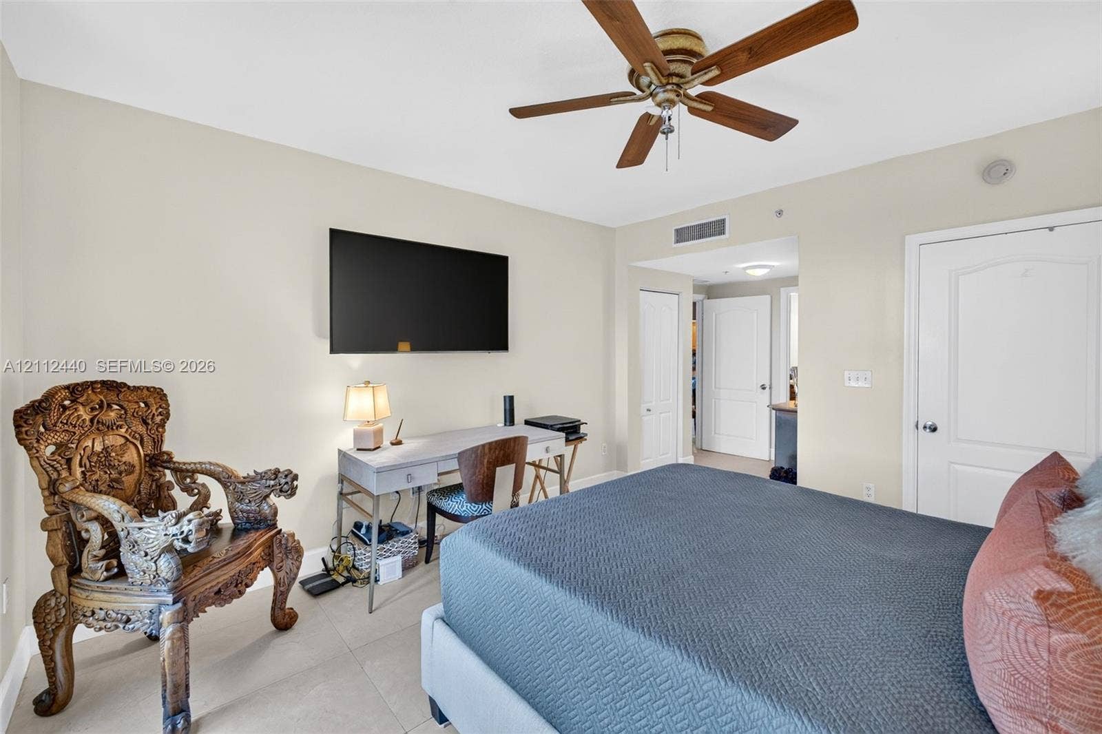 110 N Federal Highway, #914, Fort Lauderdale, FL 33301 Neutral-toned interior featuring large-format porcelain flooring, a ceiling fan with wood-finish blades, and a walk in closet as well as separate coat closet
