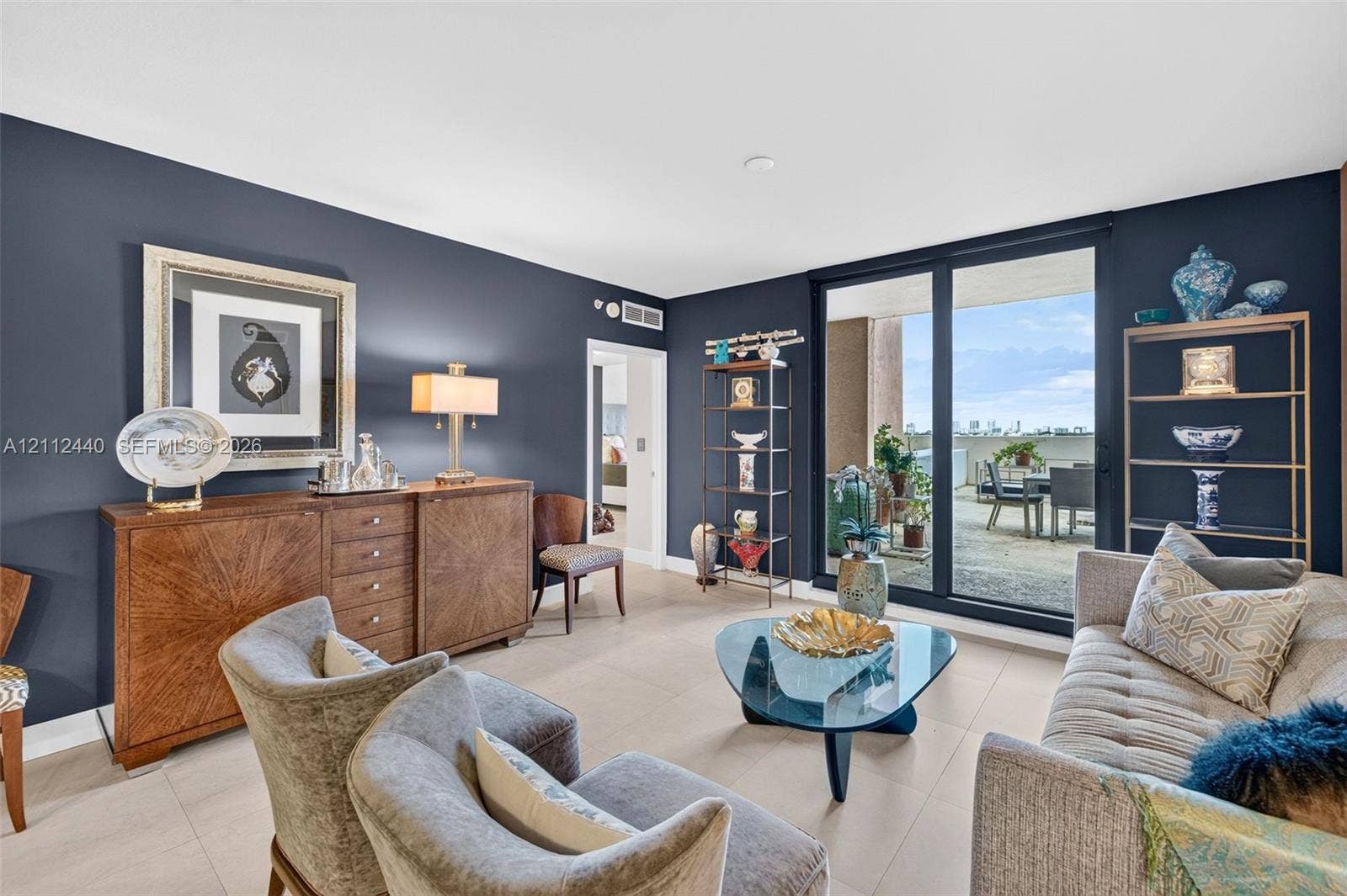 110 N Federal Highway, #914, Fort Lauderdale, FL 33301 Living area featuring large-format porcelain flooring, floor-to-ceiling impact glass sliding doors, and a private OVERSIZED balcony