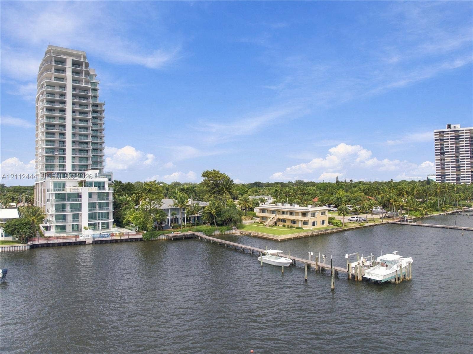 Waterfront residential site featuring a private deep-water dock and bulkhead along an inlet