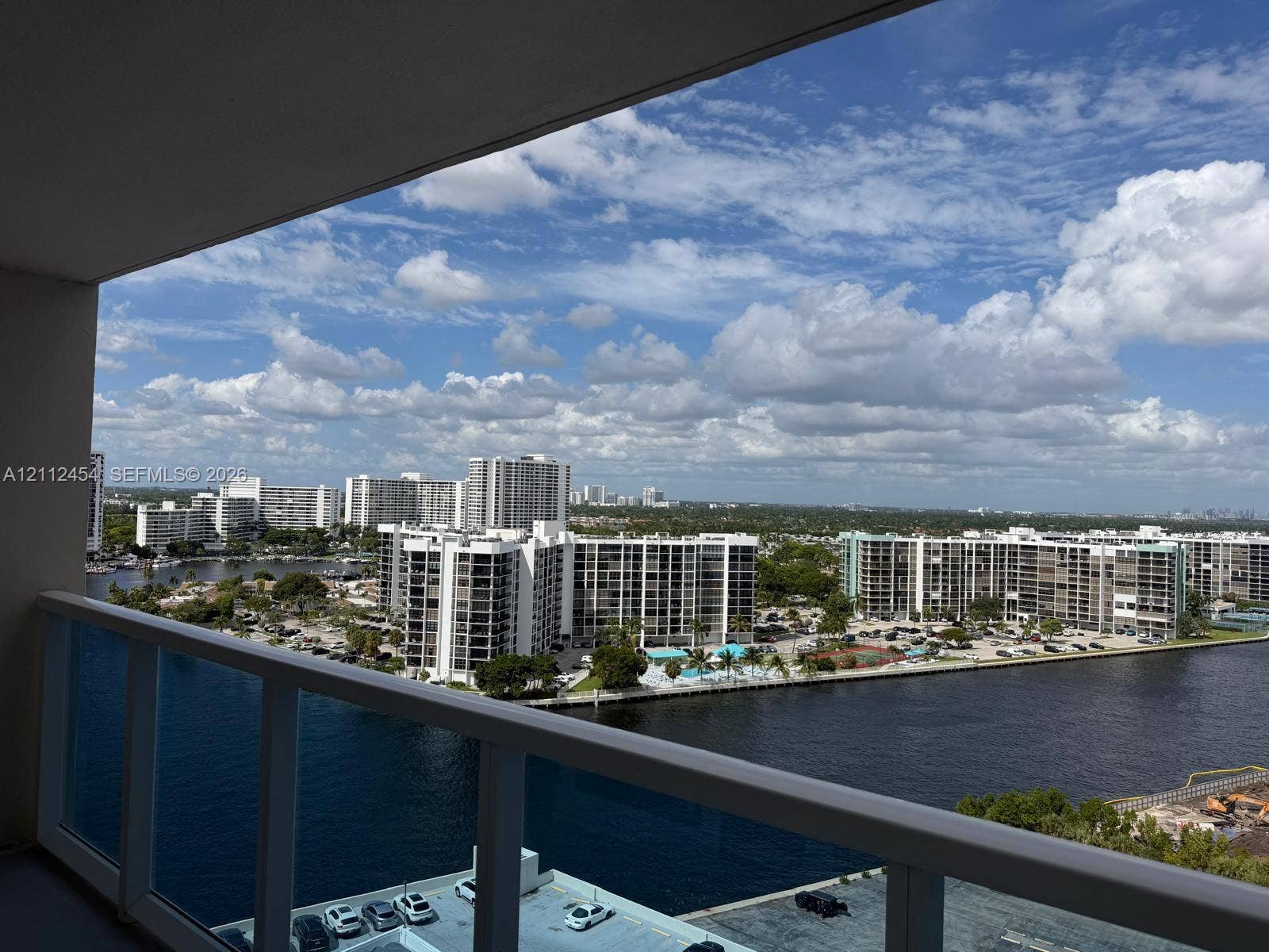 3800 S Ocean Drive, #1601, Hollywood, Hollywood, FL 33019 Private balcony featuring a white aluminum railing, oriented toward a waterway and urban skyline