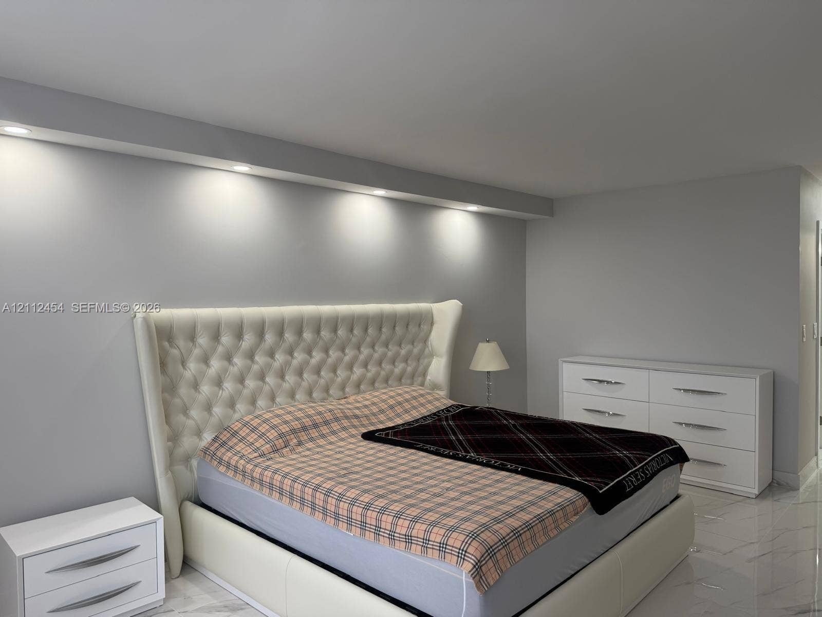 3800 S Ocean Drive, #1601, Hollywood, Hollywood, FL 33019 Neutral interior featuring light-toned flooring, recessed ceiling lighting, and a custom architectural soffit