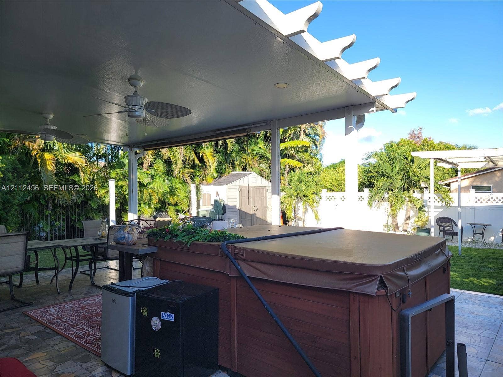 3961 NW 110th Avenue, #3961, Coral Springs, Coral Springs, FL 33065 Covered patio featuring a white pergola, recessed lighting, dual ceiling fans, and paver flooring