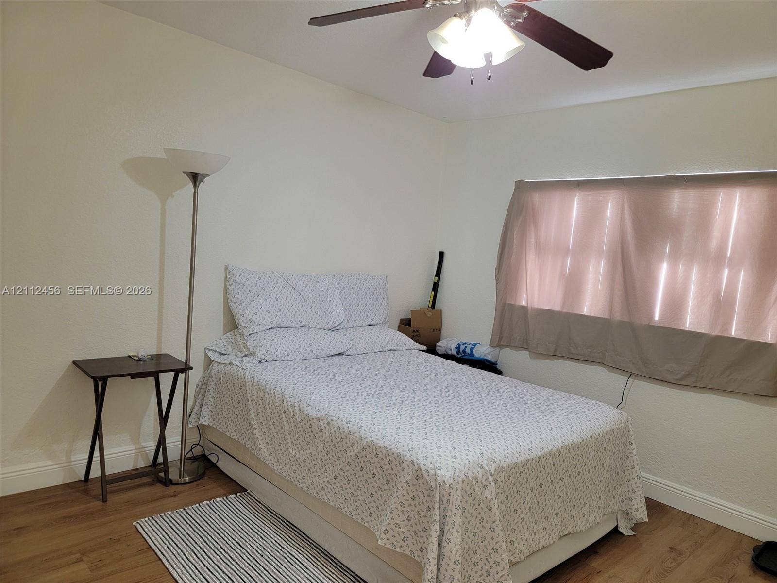 3961 NW 110th Avenue, #3961, Coral Springs, Coral Springs, FL 33065 Room featuring wood-finish flooring and a ceiling fan with integrated light fixture