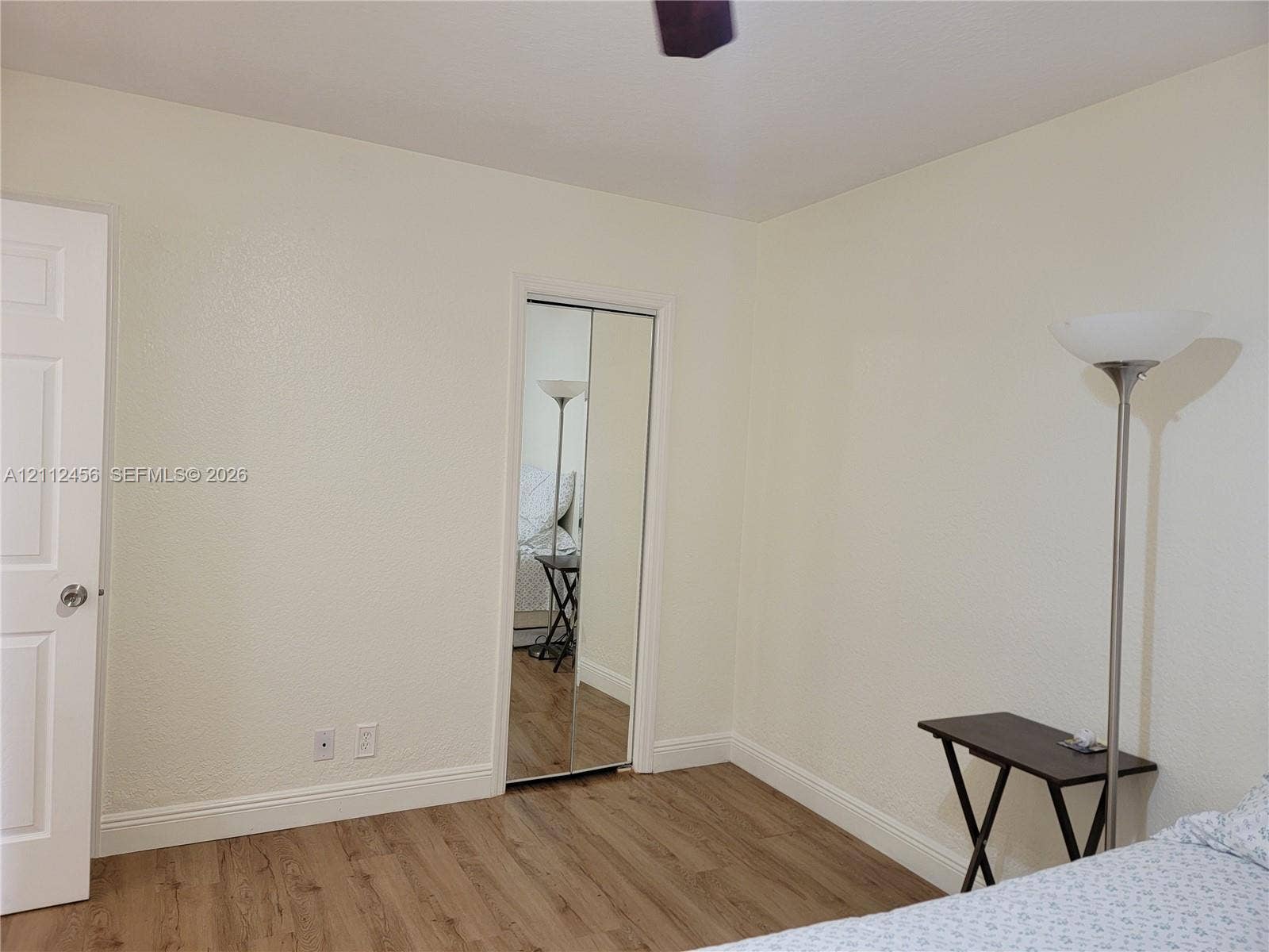3961 NW 110th Avenue, #3961, Coral Springs, Coral Springs, FL 33065 Wood-finish flooring, dual-panel interior door, and mirrored closet doors