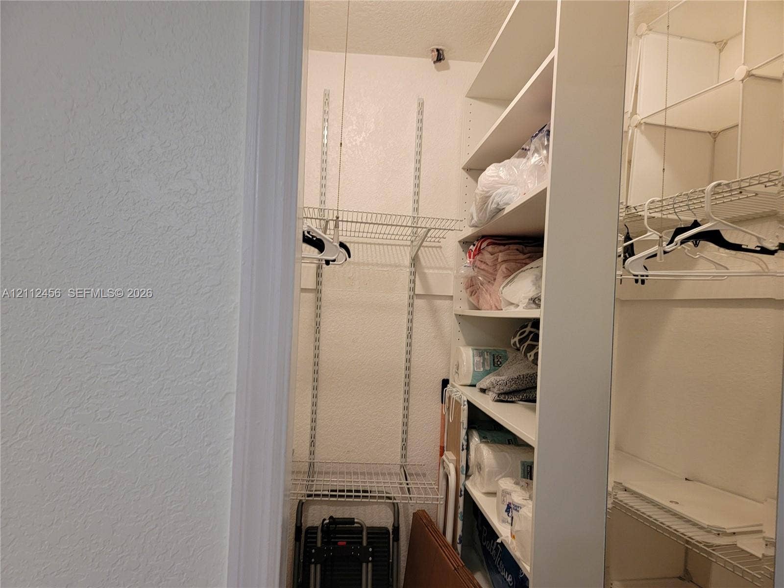 3961 NW 110th Avenue, #3961, Coral Springs, Coral Springs, FL 33065 Walk-in storage space featuring built-in vertical shelving units and tiered wire rack organization systems