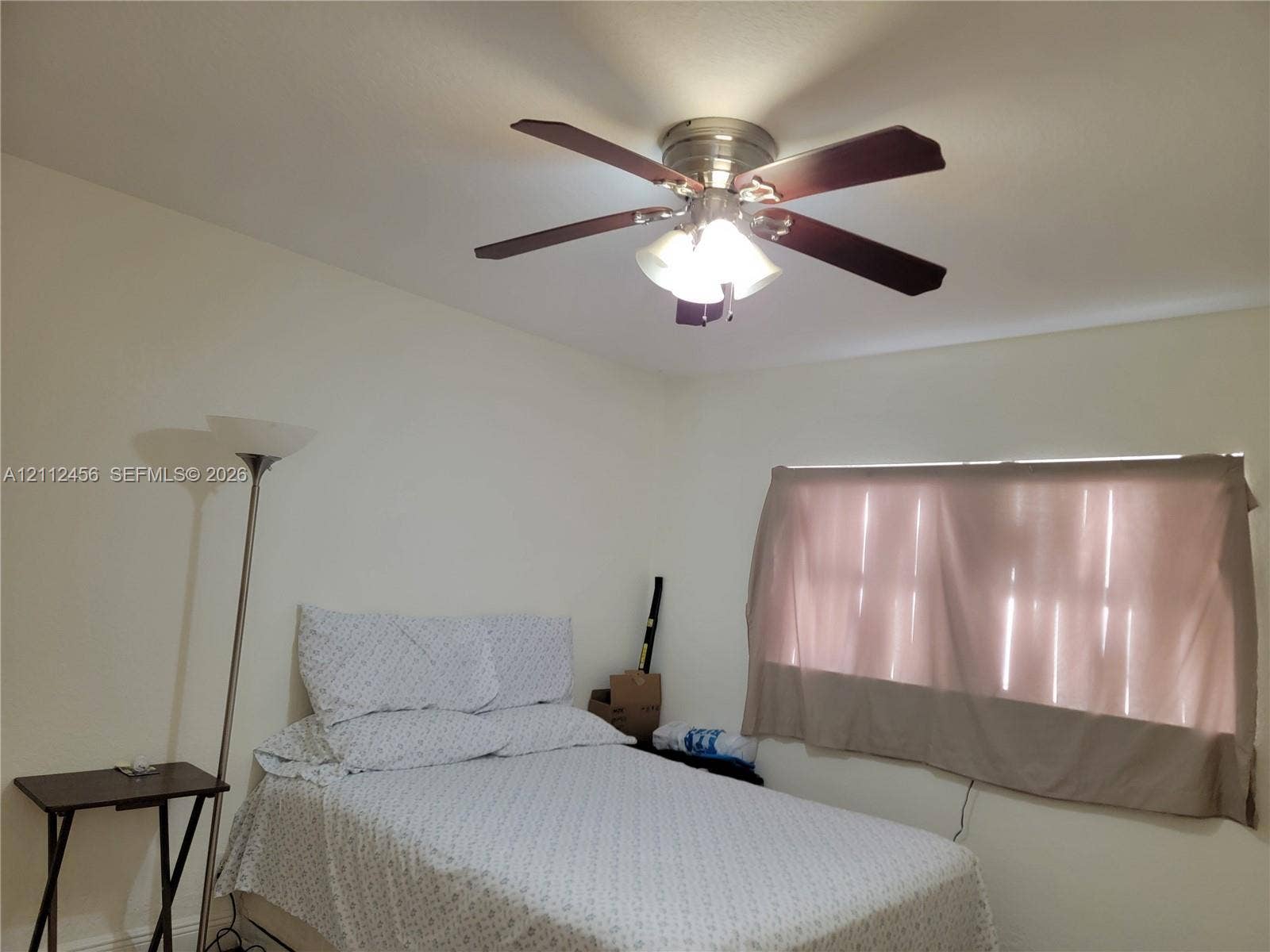3961 NW 110th Avenue, #3961, Coral Springs, Coral Springs, FL 33065 Ceiling-mounted fan featuring a metallic finish and multi-blade configuration with an integrated three-light fixture