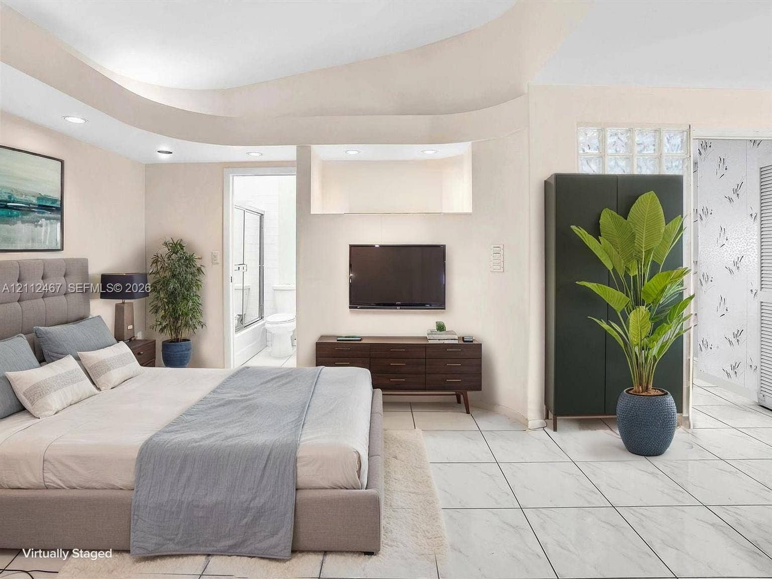 250 NE 212th Street, Miami, Miami, FL 33179 Tray ceiling with recessed lighting, large-format tile flooring, and glass block wall accent