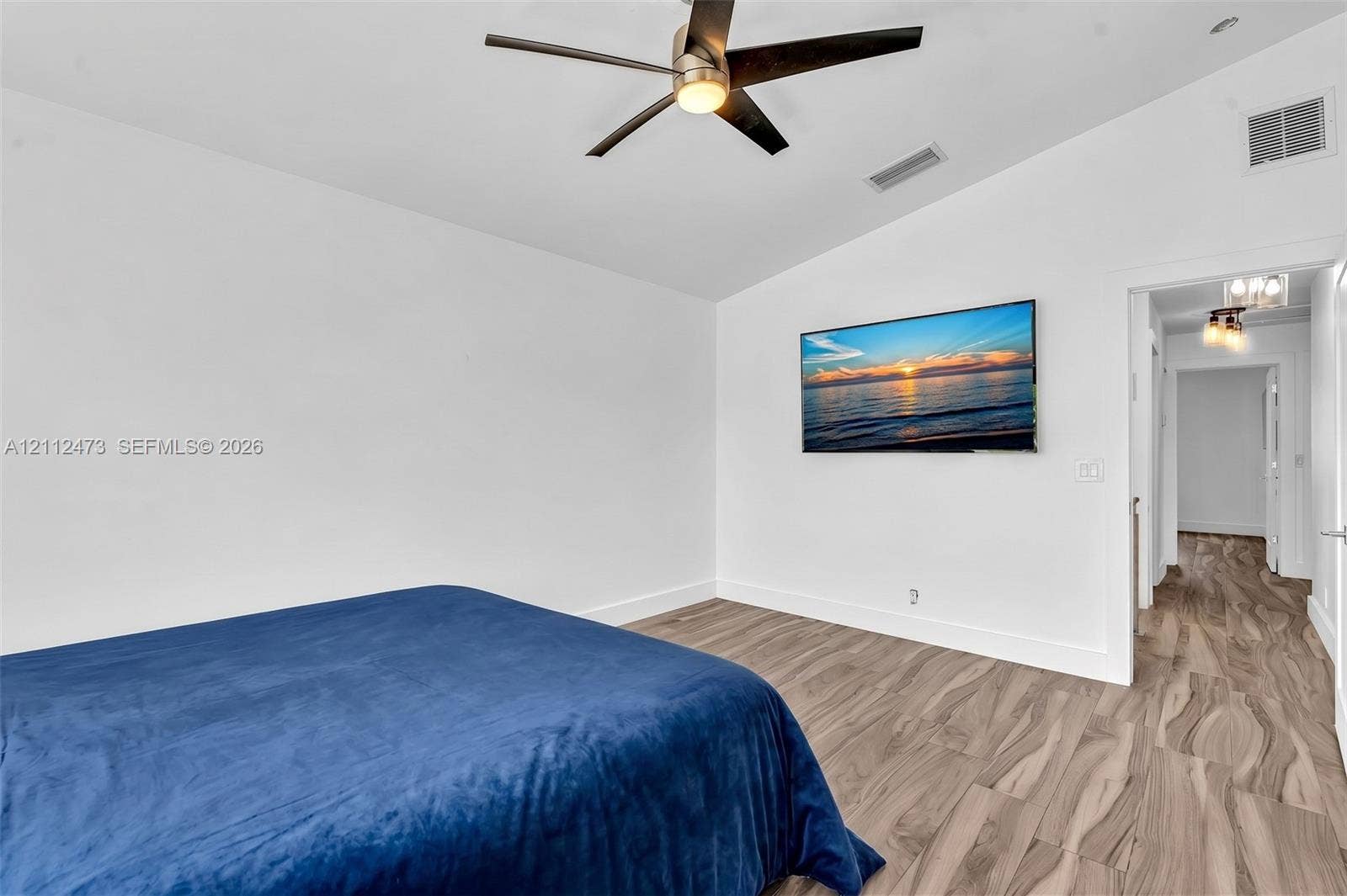 3340 SW 50th Street, Hollywood, Hollywood, FL 33312 Vaulted ceilings, wood-finish flooring, and a modern ceiling fan