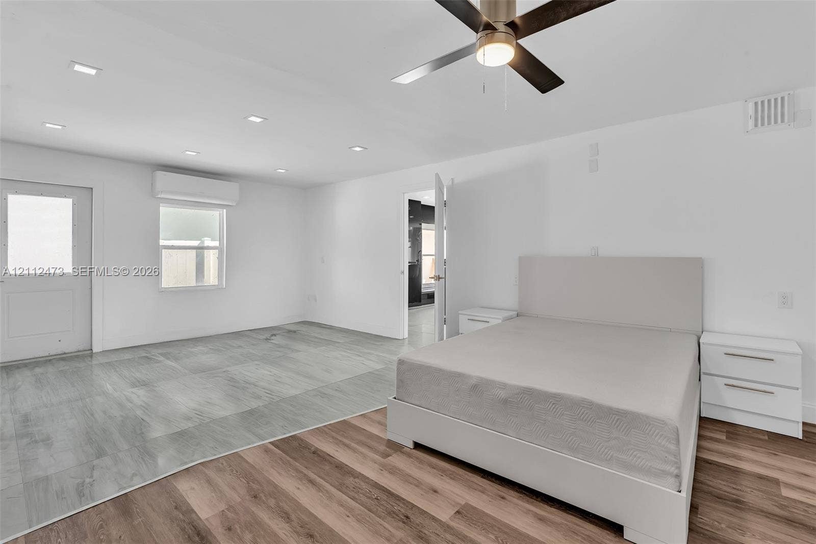 3340 SW 50th Street, Hollywood, Hollywood, FL 33312 Interior space featuring wood-finish flooring, recessed lighting, ceiling fan with integrated light, and wall-mounted climate control unit