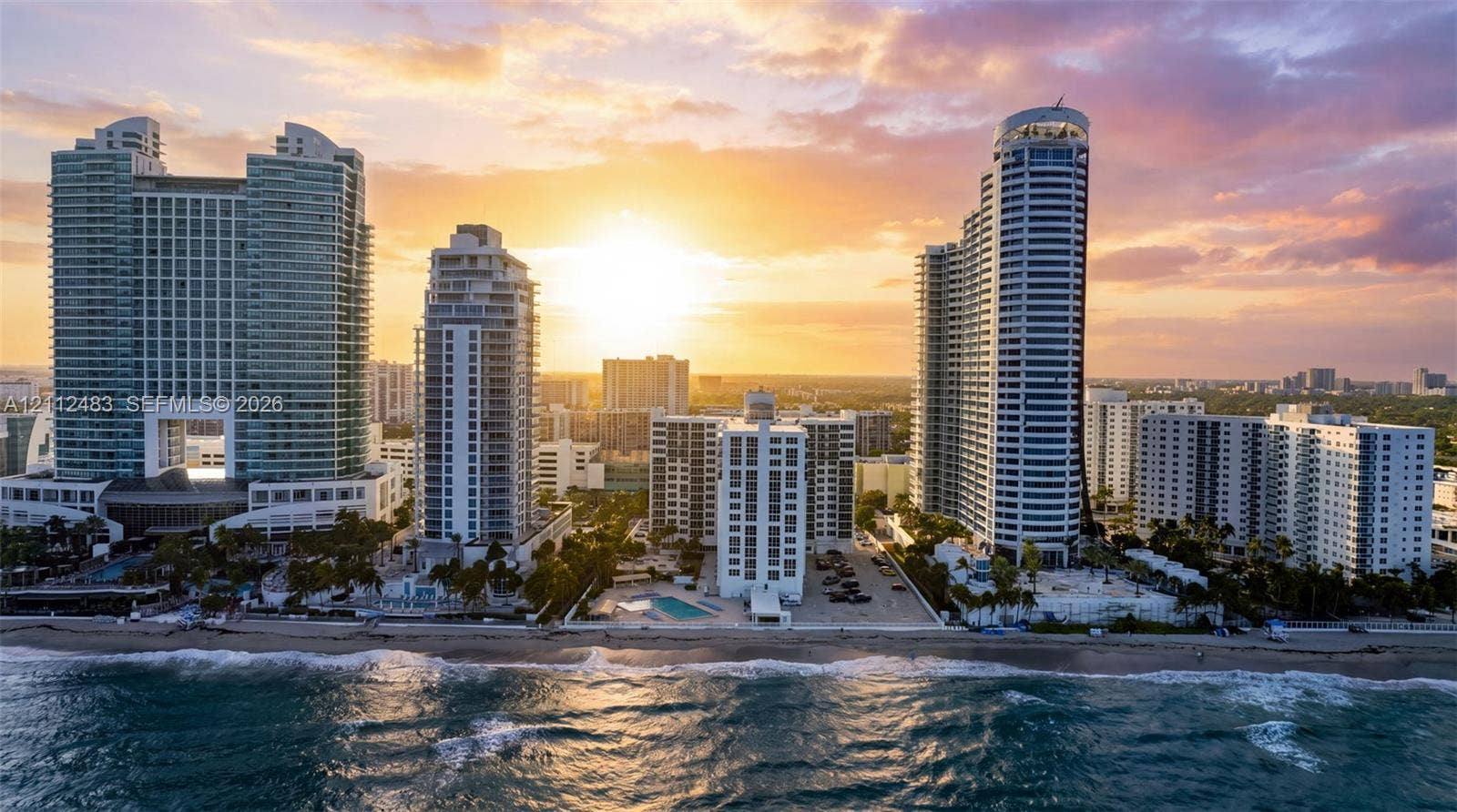 3505 S Ocean Drive, #1101, Hollywood, FL 33019 High-rise coastal development featuring glass-facade towers, direct beachfront access, and private outdoor swimming pools