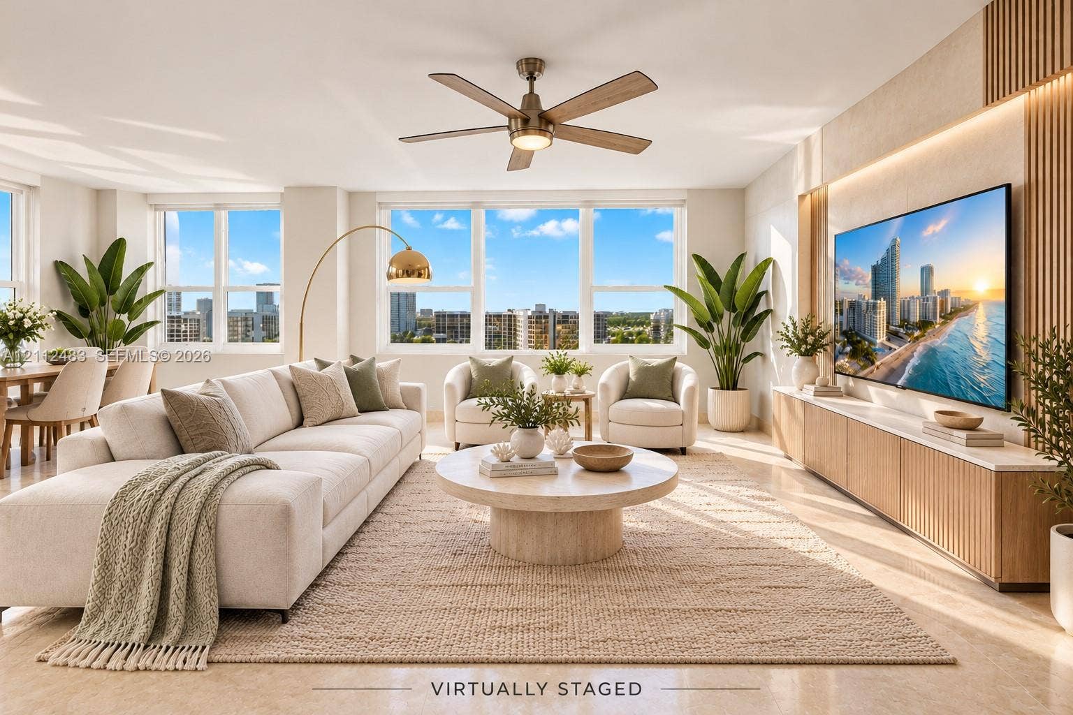 3505 S Ocean Drive, #1101, Hollywood, FL 33019 Living area featuring expansive windows, built-in wooden media cabinetry with integrated lighting, polished stone-finish flooring, and a central ceiling fan