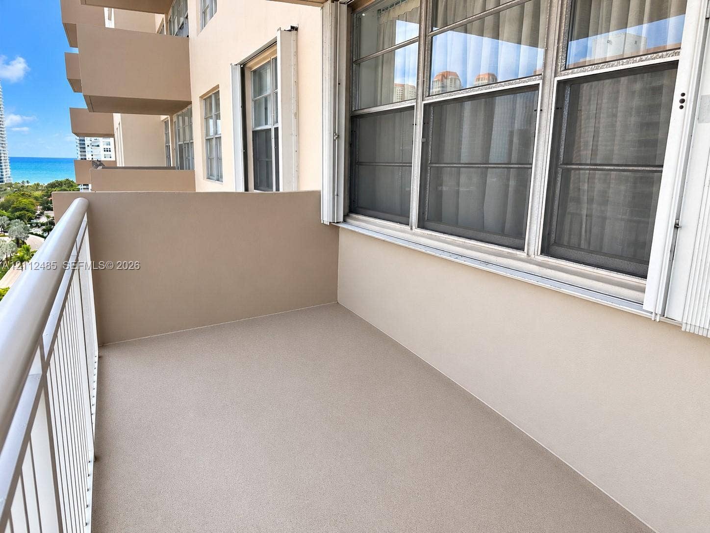 250 174th Street, #1707, Sunny Isles Beach, Sunny Isles Beach, FL 33160 Private balcony featuring a solid surface floor, metal railing, and aluminum-frame windows
