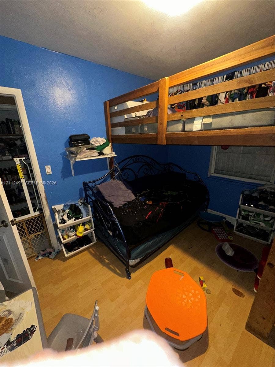 2509 Grant Street, Hollywood, FL 33020 Room featuring wood-finish flooring and a built-in wall shelf