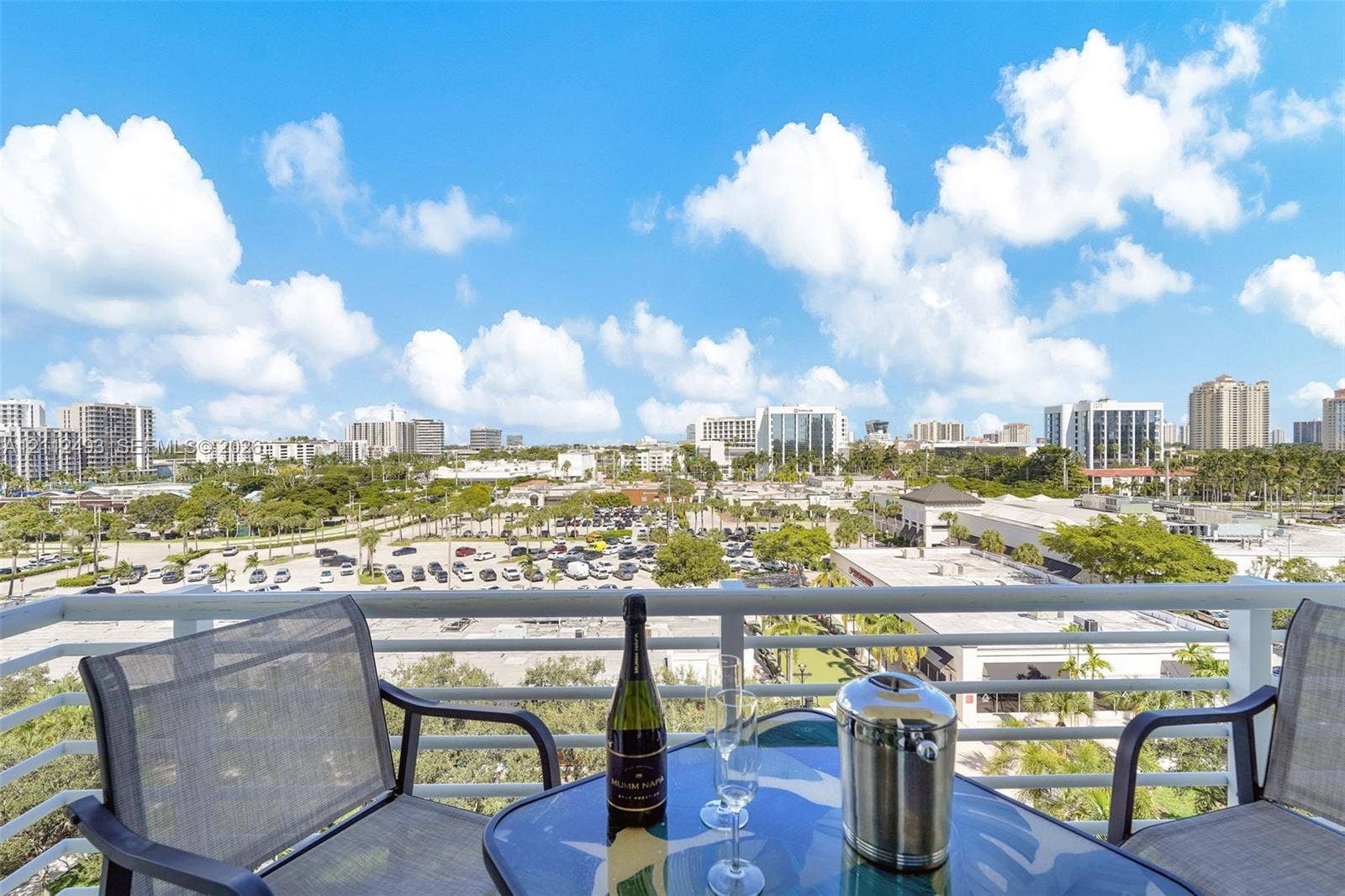 Balcony featuring white metal railings and expansive exterior surroundings