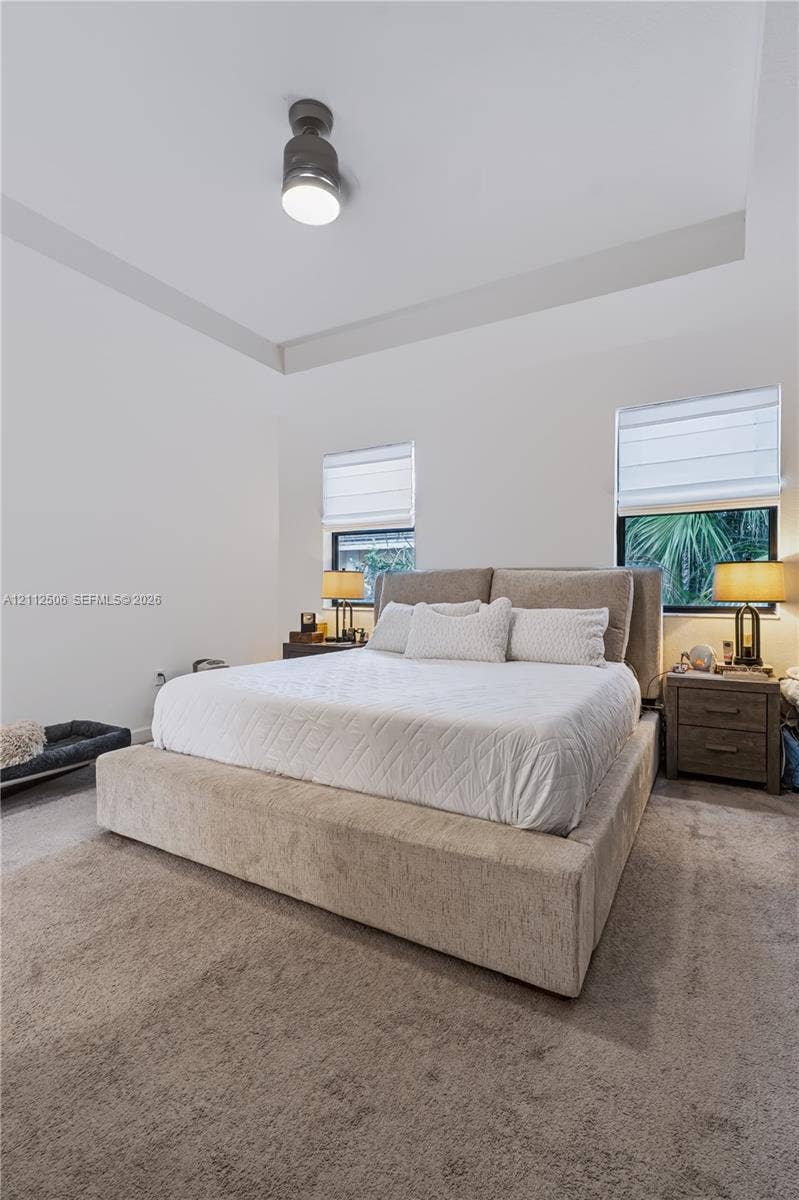 538 SW 19th Terrace, Fort Lauderdale, Fort Lauderdale, FL 33312 Tray ceiling featuring a central flush-mount light fixture, carpeting, and dual windows with roman shades