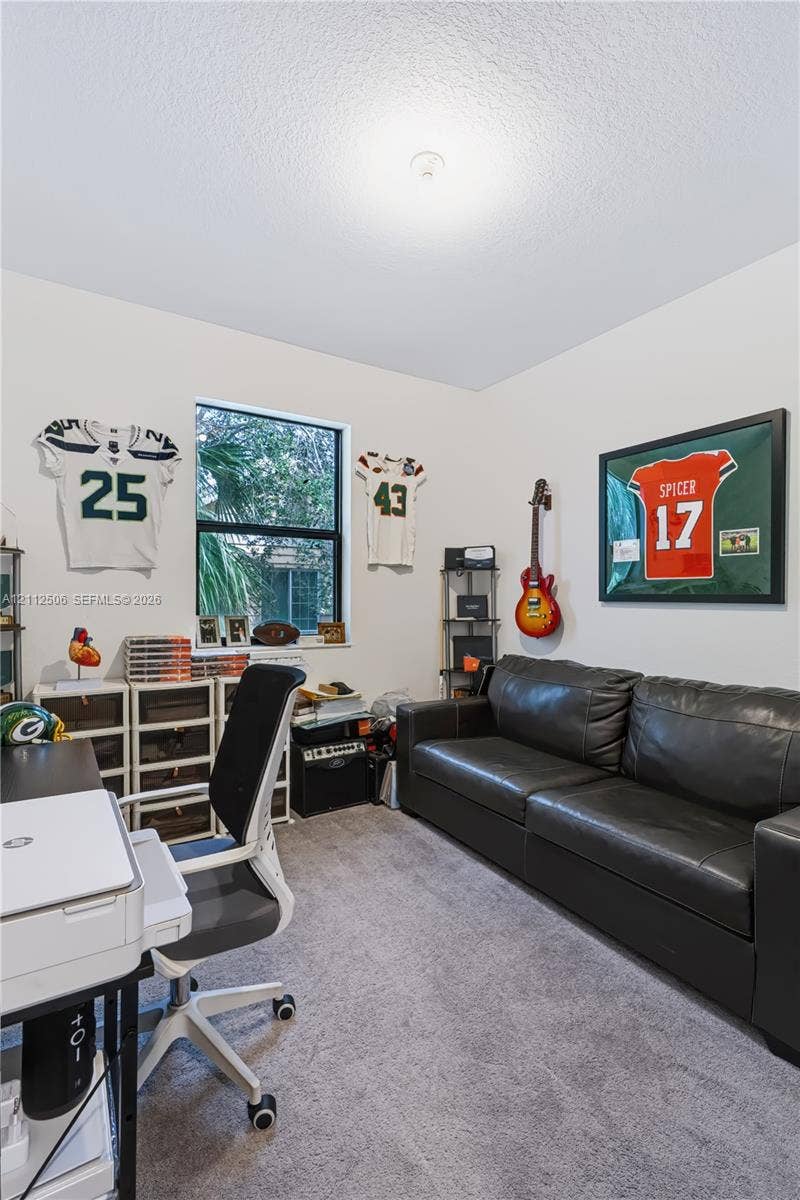 538 SW 19th Terrace, Fort Lauderdale, Fort Lauderdale, FL 33312 Neutral-toned interior room featuring wall-to-wall carpeting and a single-pane window with dark framing