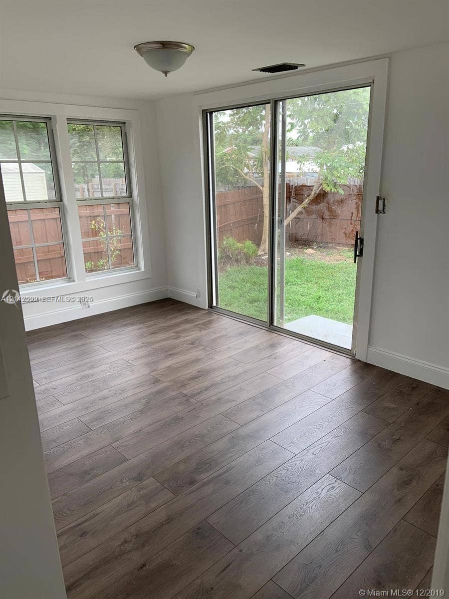 215 4th Street, #1, Jupiter, Jupiter, FL 33458 Wood-finish flooring, multi-pane windows, and sliding glass door