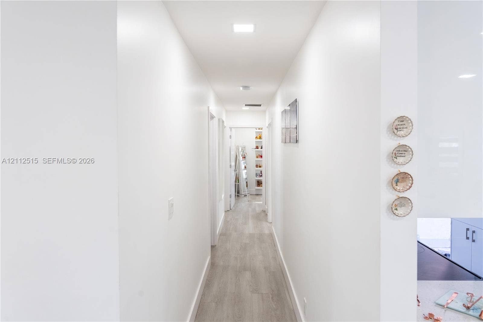 Hallandale Beach, FL 33009 Hallway featuring wood-finish flooring and recessed lighting