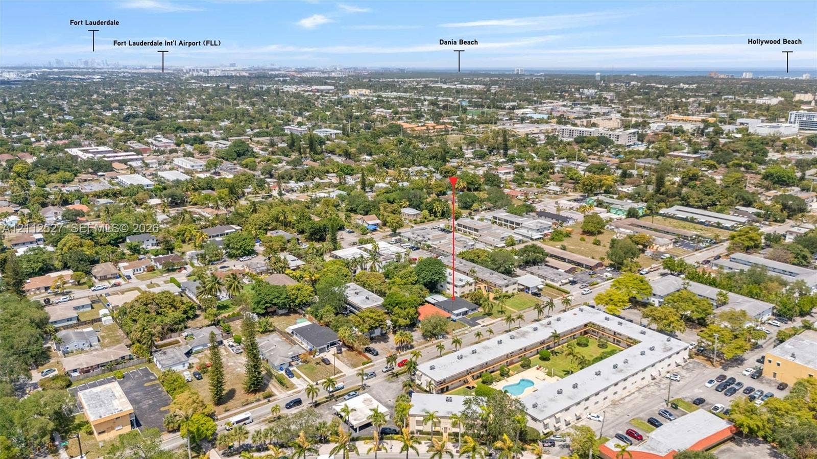 2517 Polk Street, Hollywood, Hollywood, FL 33020 Aerial perspective of a multi-unit residential property featuring a flat roofline, manicured courtyard, integrated pool, and established landscaping