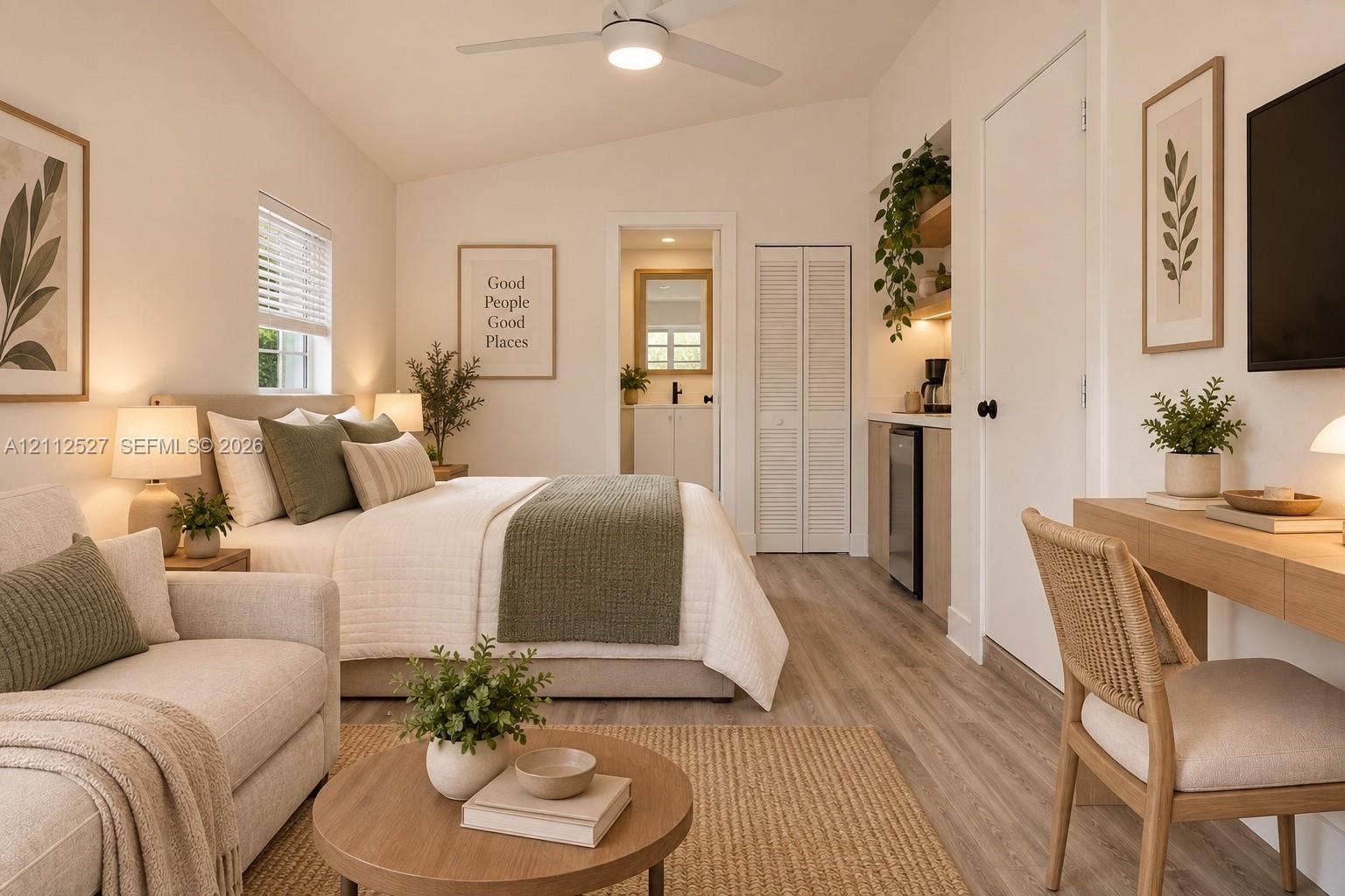 2517 Polk Street, Hollywood, Hollywood, FL 33020 Vaulted ceilings with a central ceiling fan, wood-finish flooring, built-in kitchenette cabinetry, and louvered closet doors